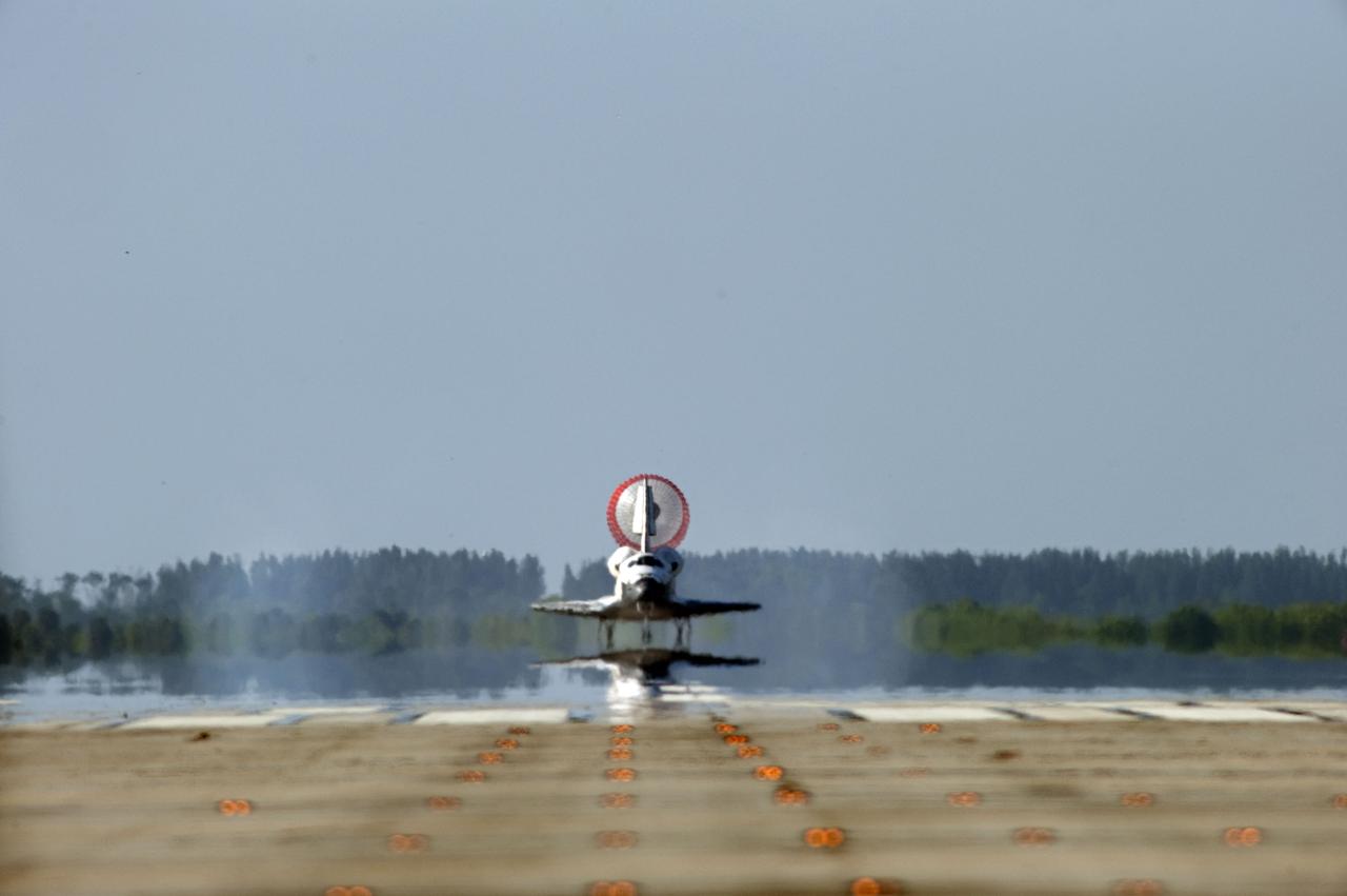STS132-S-132 (26 May 2010) --- Space shuttle Atlantis? drag chute is deployed as the spacecraft rolls toward wheels stop on Runway 33 at the Shuttle Landing Facility at NASA's Kennedy Space Center in Florida. Landing was at 8:48 a.m. (EDT) on May 26, 2010, completing the 12-day STS-132 mission to the International Space Station. Main gear touchdown was at 8:48:11 a.m., followed by nose gear touchdown at 8:48:21 a.m. and wheelstop at 8:49:18 a.m. Onboard are NASA astronauts Ken Ham, commander; Tony Antonelli, pilot; Garrett Reisman, Michael Good, Steve Bowen and Piers Sellers, all mission specialists. The six-member STS-132 crew carried the Russian-built Mini Research Module 1 (MRM1) to the orbital complex. STS-132 is the 34th shuttle mission to the station, the 132nd shuttle mission overall and the last planned flight for Atlantis.