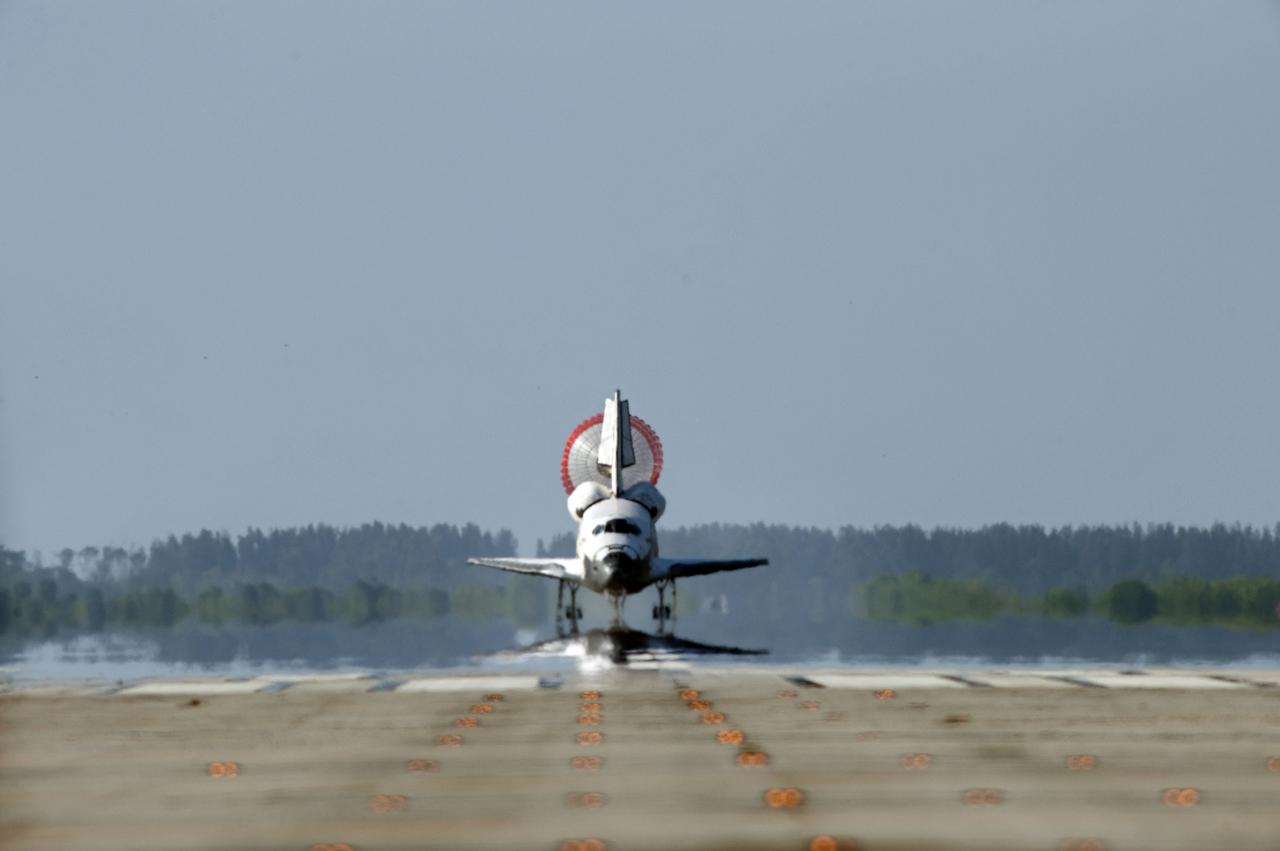 STS132-S-133 (26 May 2010) --- Space shuttle Atlantis? drag chute is deployed as the spacecraft rolls toward wheels stop on Runway 33 at the Shuttle Landing Facility at NASA's Kennedy Space Center in Florida. Landing was at 8:48 a.m. (EDT) on May 26, 2010, completing the 12-day STS-132 mission to the International Space Station. Main gear touchdown was at 8:48:11 a.m., followed by nose gear touchdown at 8:48:21 a.m. and wheelstop at 8:49:18 a.m. Onboard are NASA astronauts Ken Ham, commander; Tony Antonelli, pilot; Garrett Reisman, Michael Good, Steve Bowen and Piers Sellers, all mission specialists. The six-member STS-132 crew carried the Russian-built Mini Research Module 1 (MRM1) to the orbital complex. STS-132 is the 34th shuttle mission to the station, the 132nd shuttle mission overall and the last planned flight for Atlantis.