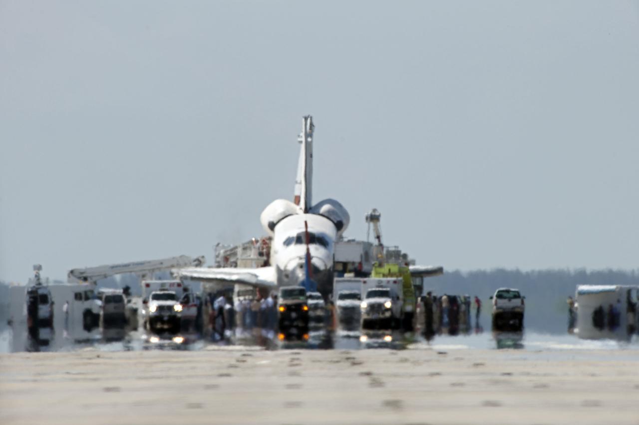 STS132-S-135 (26 May 2010) --- A convoy of safing and emergency vehicles meet space shuttle Atlantis on Runway 33 at the Shuttle Landing Facility at NASA's Kennedy Space Center in Florida. Landing was at 8:48 a.m. (EDT) on May 26, 2010, completing the 12-day STS-132 mission to the International Space Station. Main gear touchdown was at 8:48:11 a.m., followed by nose gear touchdown at 8:48:21 a.m. and wheelstop at 8:49:18 a.m. Onboard are NASA astronauts Ken Ham, commander; Tony Antonelli, pilot; Garrett Reisman, Michael Good, Steve Bowen and Piers Sellers, all mission specialists. The six-member STS-132 crew carried the Russian-built Mini Research Module 1 (MRM1) to the orbital complex. STS-132 is the 34th shuttle mission to the station, the 132nd shuttle mission overall and the last planned flight for Atlantis.