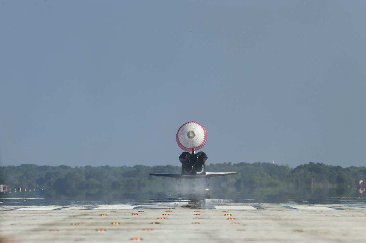 STS132-S-138 (26 May 2010) --- Space shuttle Atlantis? drag chute is deployed as the spacecraft rolls toward wheels stop on Runway 33 at the Shuttle Landing Facility at NASA's Kennedy Space Center in Florida. Landing was at 8:48 a.m. (EDT) on May 26, 2010, completing the 12-day STS-132 mission to the International Space Station. Main gear touchdown was at 8:48:11 a.m., followed by nose gear touchdown at 8:48:21 a.m. and wheelstop at 8:49:18 a.m. Onboard are NASA astronauts Ken Ham, commander; Tony Antonelli, pilot; Garrett Reisman, Michael Good, Steve Bowen and Piers Sellers, all mission specialists. The six-member STS-132 crew carried the Russian-built Mini Research Module 1 (MRM1) to the orbital complex. STS-132 is the 34th shuttle mission to the station, the 132nd shuttle mission overall and the last planned flight for Atlantis.