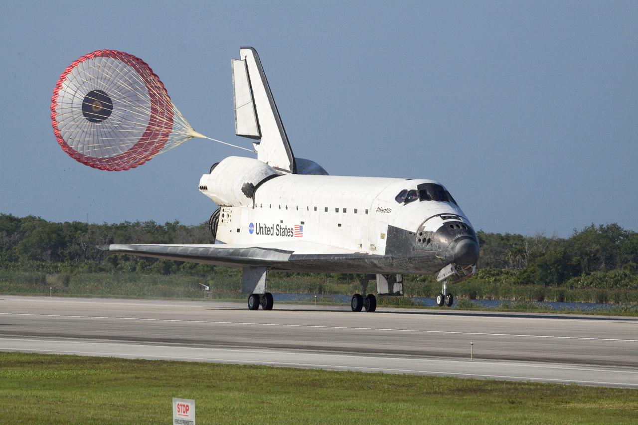 STS132-S-142 (26 May 2010) --- Space shuttle Atlantis? drag chute is deployed as the spacecraft rolls toward wheels stop on Runway 33 at the Shuttle Landing Facility at NASA's Kennedy Space Center in Florida. Landing was at 8:48 a.m. (EDT) on May 26, 2010, completing the 12-day STS-132 mission to the International Space Station. Main gear touchdown was at 8:48:11 a.m., followed by nose gear touchdown at 8:48:21 a.m. and wheelstop at 8:49:18 a.m. Onboard are NASA astronauts Ken Ham, commander; Tony Antonelli, pilot; Garrett Reisman, Michael Good, Steve Bowen and Piers Sellers, all mission specialists. The six-member STS-132 crew carried the Russian-built Mini Research Module 1 (MRM1) to the orbital complex. STS-132 is the 34th shuttle mission to the station, the 132nd shuttle mission overall and the last planned flight for Atlantis.