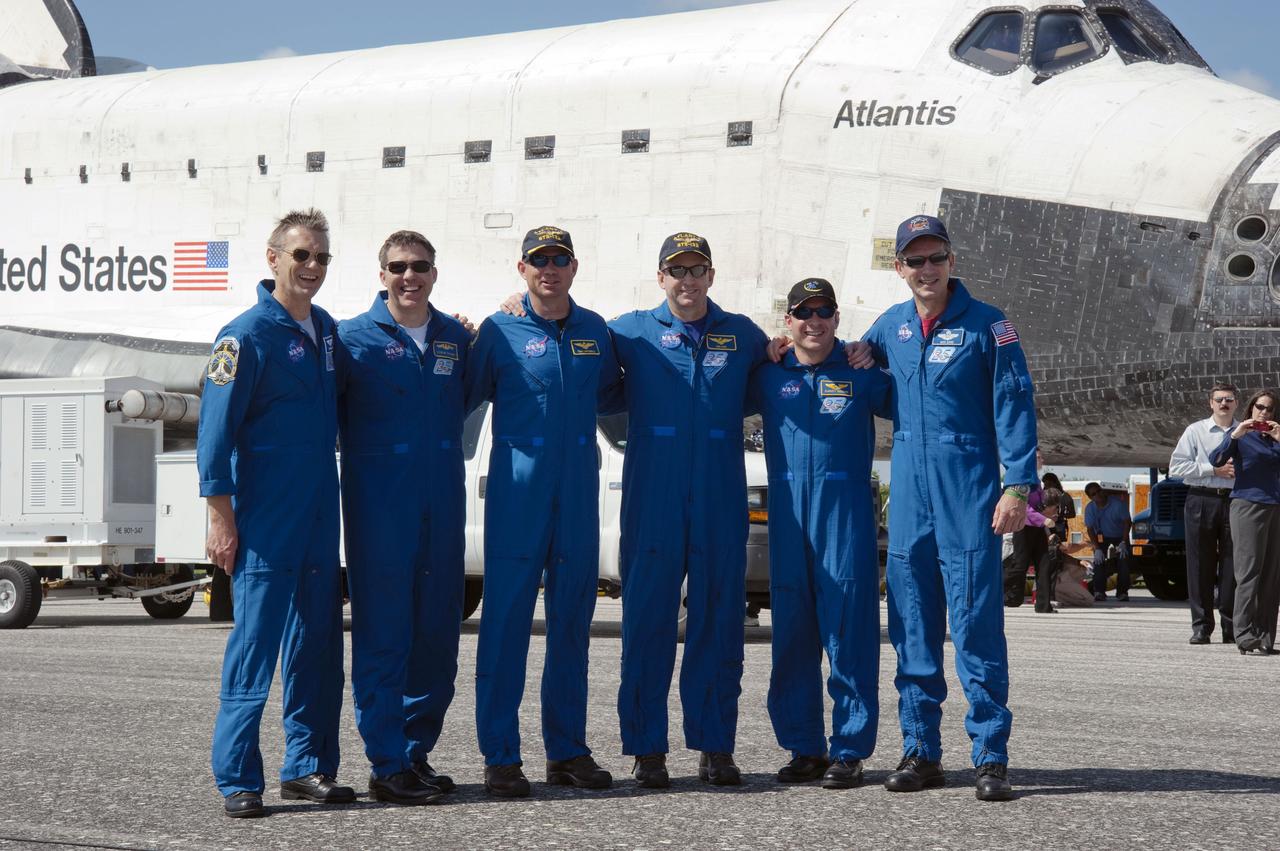 STS132-S-154 (26 May 2010) --- At the Shuttle Landing Facility at NASA's Kennedy Space Center in Florida, the STS-132 crew members of space shuttle Atlantis pause for a post-landing photo opportunity. From left are NASA astronauts Piers Sellers and Steve Bowen, both mission specialists; Tony Antonelli, pilot; Ken Ham, commander; and Garrett Reisman and Michael Good, both mission specialists. The six-member STS-132 crew carried the Russian-built Mini Research Module 1 to the space station. STS-132 is the 34th shuttle mission to the station, the 132nd shuttle mission overall and the last planned flight for Atlantis.
