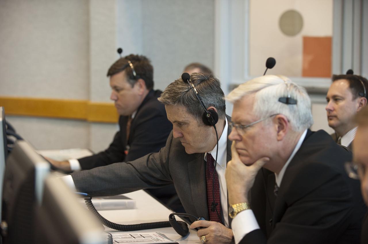 STS133-S-062 (24 Feb. 2011) --- In Firing Room 4 of the Launch Control Center at NASA's Kennedy Space Center in Florida, Stennis Center Director Patrick Scheuermann, left, Kennedy's Center Director Bob Cabana, Johnson Space Center Director Mike Coats and Marshall Center Director Robert Lightfoot (extreme right), monitor the countdown to launch of space shuttle Discovery on its STS-133 mission to the International Space Station. Discovery and its six-member crew are on a mission to deliver the Permanent Multipurpose Module, packed with supplies and critical spare parts, as well as Robonaut 2, the dexterous humanoid astronaut helper, to the orbiting outpost. Discovery is making its 39th mission and is scheduled to be retired following STS-133. This is the 133rd Space Shuttle Program mission and the 35th shuttle voyage to the space station. Photo credit: NASA or National Aeronautics and Space Administration