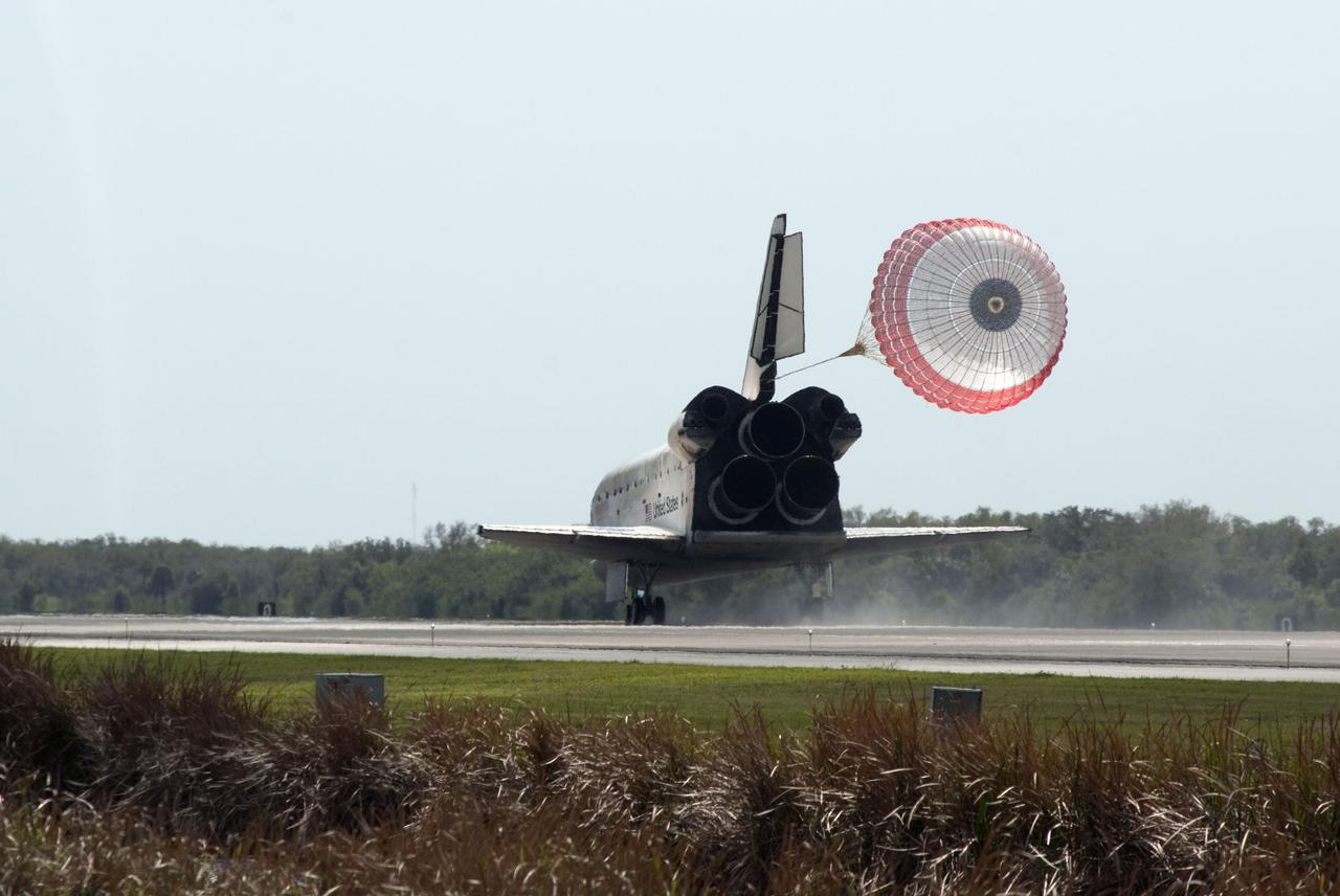 STS133-S-104 (9 March 2011) --- Space shuttle Discovery’s drag chute is deployed as the spacecraft rolls toward wheels stop on Runway 15 at the Shuttle Landing Facility at NASA’s Kennedy Space Center in Florida. Landing was at 11:57 a.m. (EST) on March 9, 2011, completing a more than 12-day STS-133 mission to the International Space Station. Onboard are NASA astronauts Steve Lindsey, commander; Eric Boe, pilot; Steve Bowen, Alvin Drew, Michael Barratt and Nicole Stott, all mission specialists. Discovery and its six-member crew delivered the Permanent Multipurpose Module, packed with supplies and critical spare parts, as well as Robonaut 2, the dexterous humanoid astronaut helper, to the orbiting outpost. STS-133 was Discovery's 39th and final mission. This was the 133rd Space Shuttle Program mission and the 35th shuttle voyage to the space station. Photo credit: NASA or National Aeronautics and Space Administration