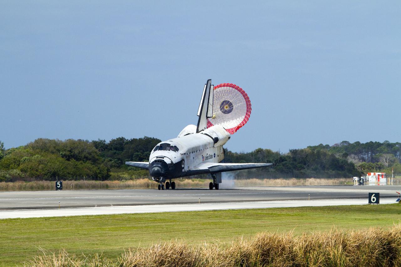 STS133-S-107 (9 March 2011) --- Space shuttle Discovery’s drag chute is deployed as the spacecraft rolls toward wheels stop on Runway 15 at the Shuttle Landing Facility at NASA’s Kennedy Space Center in Florida. Landing was at 11:57 a.m. (EST) on March 9, 2011, completing a more than 12-day STS-133 mission to the International Space Station. Onboard are NASA astronauts Steve Lindsey, commander; Eric Boe, pilot; Steve Bowen, Alvin Drew, Michael Barratt and Nicole Stott, all mission specialists. Discovery and its six-member crew delivered the Permanent Multipurpose Module, packed with supplies and critical spare parts, as well as Robonaut 2, the dexterous humanoid astronaut helper, to the orbiting outpost. STS-133 was Discovery's 39th and final mission. This was the 133rd Space Shuttle Program mission and the 35th shuttle voyage to the space station. Photo credit: NASA or National Aeronautics and Space Administration