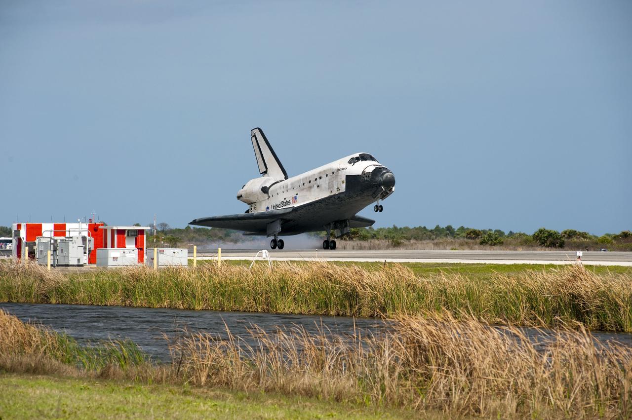 STS133-S-112 (9 March 2011) --- Space shuttle Discovery’s main gear touches down on Runway 15 at the Shuttle Landing Facility at NASA’s Kennedy Space Center in Florida. Landing was at 11:57 a.m. (EST) on March 9, 2011, completing a more than 12-day STS-133 mission to the International Space Station. Onboard are NASA astronauts Steve Lindsey, commander; Eric Boe, pilot; Steve Bowen, Alvin Drew, Michael Barratt and Nicole Stott, all mission specialists. Discovery and its six-member crew delivered the Permanent Multipurpose Module, packed with supplies and critical spare parts, as well as Robonaut 2, the dexterous humanoid astronaut helper, to the orbiting outpost. STS-133 was Discovery's 39th and final mission. This was the 133rd Space Shuttle Program mission and the 35th shuttle voyage to the space station. Photo credit: NASA or National Aeronautics and Space Administration