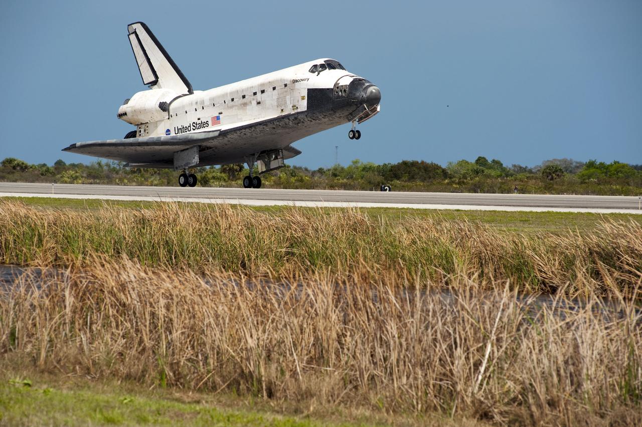 STS133-S-113 (9 March 2011) --- Space shuttle Discovery’s main gear touches down on Runway 15 at the Shuttle Landing Facility at NASA’s Kennedy Space Center in Florida. Landing was at 11:57 a.m. (EST) on March 9, 2011, completing a more than 12-day STS-133 mission to the International Space Station. Onboard are NASA astronauts Steve Lindsey, commander; Eric Boe, pilot; Steve Bowen, Alvin Drew, Michael Barratt and Nicole Stott, all mission specialists. Discovery and its six-member crew delivered the Permanent Multipurpose Module, packed with supplies and critical spare parts, as well as Robonaut 2, the dexterous humanoid astronaut helper, to the orbiting outpost. STS-133 was Discovery's 39th and final mission. This was the 133rd Space Shuttle Program mission and the 35th shuttle voyage to the space station. Photo credit: NASA or National Aeronautics and Space Administration