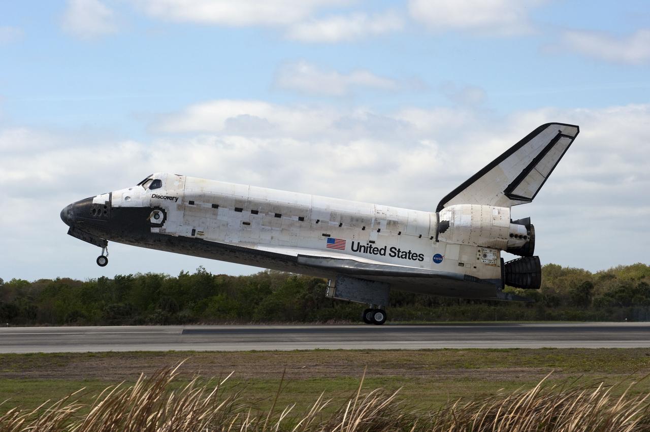 STS133-S-115 (9 March 2011) --- Space shuttle Discovery’s main gear touches down on Runway 15 at the Shuttle Landing Facility at NASA’s Kennedy Space Center in Florida. Landing was at 11:57 a.m. (EST) on March 9, 2011, completing a more than 12-day STS-133 mission to the International Space Station. Onboard are NASA astronauts Steve Lindsey, commander; Eric Boe, pilot; Steve Bowen, Alvin Drew, Michael Barratt and Nicole Stott, all mission specialists. Discovery and its six-member crew delivered the Permanent Multipurpose Module, packed with supplies and critical spare parts, as well as Robonaut 2, the dexterous humanoid astronaut helper, to the orbiting outpost. STS-133 was Discovery's 39th and final mission. This was the 133rd Space Shuttle Program mission and the 35th shuttle voyage to the space station. Photo credit: NASA or National Aeronautics and Space Administration