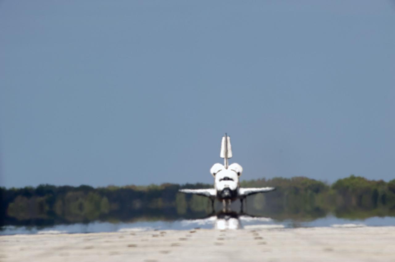 STS133-S-133 (9 March 2011) --- Space shuttle Discovery rolls down Runway 15 at the Shuttle Landing Facility at NASA's Kennedy Space Center in Florida. Landing was at 11:57 a.m. (EST) on March 9, 2011, completing a more than 12-day STS-133 mission to the International Space Station. Onboard are NASA astronauts Steve Lindsey, commander; Eric Boe, pilot; Steve Bowen, Alvin Drew, Michael Barratt and Nicole Stott, all mission specialists. Discovery and its six-member crew delivered the Permanent Multipurpose Module, packed with supplies and critical spare parts, as well as Robonaut 2, the dexterous humanoid astronaut helper, to the orbiting outpost. STS-133 was Discovery's 39th and final mission. This was the 133rd Space Shuttle Program mission and the 35th shuttle voyage to the space station. Photo credit: NASA or National Aeronautics and Space Administration
