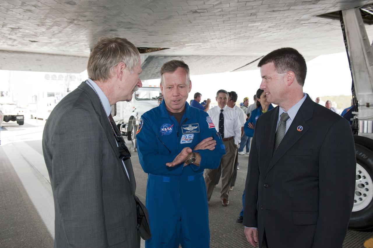 STS133-S-150 (9 March 2011) --- Associate Administrator for Space Operations Bill Gerstenmaier, left, astronaut Steve Lindsey, STS-133 commander, and Space Shuttle Launch Integration Manager Mike Moses talk about Lindsey's recent 13-day, 5.3-million-mile mission to the International Space Station aboard space shuttle Discovery. The STS-133 crew landed at 11:57 a.m. (EST) on March 9, 2011, on the Shuttle Landing Facility's Runway 15 at NASA's Kennedy Space Center in Florida. STS-133 delivered the Permanent Multipurpose Module, packed with supplies and critical spare parts, as well as Robonaut 2, the dexterous humanoid astronaut helper, to the orbiting outpost. STS-133 was Discovery's 39th and final mission. This was the 133rd Space Shuttle Program mission and the 35th shuttle voyage to the space station. Photo credit: NASA or National Aeronautics and Space Administration