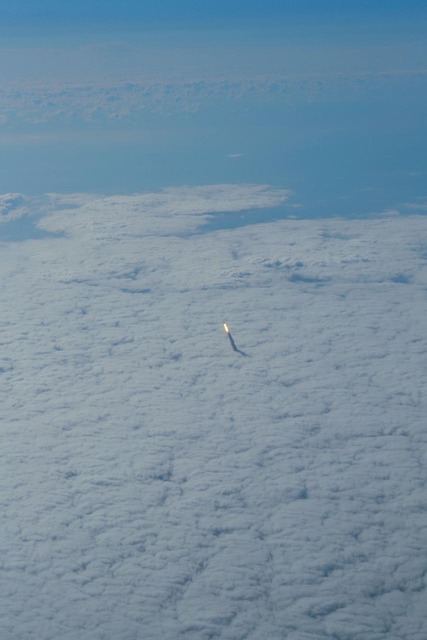 STS134-S-059 (16 May 2011) --- Photographed from a shuttle training aircraft, space shuttle Endeavour and its six-member STS-134 crew head toward Earth orbit and rendezvous with the International Space Station. Liftoff was at 8:56 a.m. (EDT) on May 16, 2011, from Launch Pad 39A at NASA's Kennedy Space Center. Onboard are NASA astronauts Mark Kelly, commander; Greg H. Johnson, pilot; Michael Fincke, Andrew Feustel, Greg Chamitoff and European Space Agency astronaut Roberto Vittori, all mission specialists. STS-134 will deliver the Alpha Magnetic Spectrometer-2 (AMS), Express Logistics Carrier-3, a high-pressure gas tank and additional spare parts for the Dextre robotic helper to the International Space Station. STS-134 is the final spaceflight for Endeavour. Photo credit: NASA