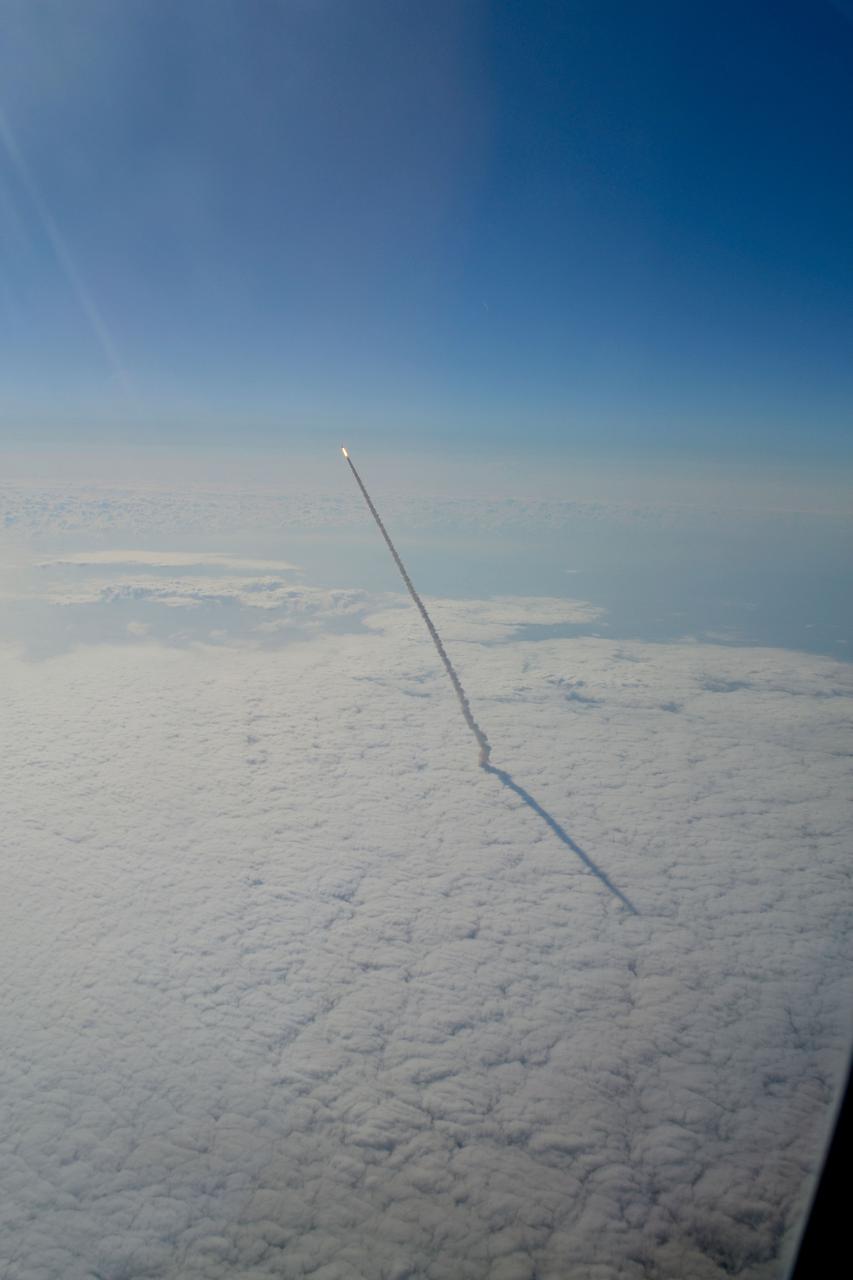 STS134-S-062 (16 May 2011) --- Photographed from a shuttle training aircraft, space shuttle Endeavour and its six-member STS-134 crew head toward Earth orbit and rendezvous with the International Space Station. Liftoff was at 8:56 a.m. (EDT) on May 16, 2011, from Launch Pad 39A at NASA's Kennedy Space Center. Onboard are NASA astronauts Mark Kelly, commander; Greg H. Johnson, pilot; Michael Fincke, Andrew Feustel, Greg Chamitoff and European Space Agency astronaut Roberto Vittori, all mission specialists. STS-134 will deliver the Alpha Magnetic Spectrometer-2 (AMS), Express Logistics Carrier-3, a high-pressure gas tank and additional spare parts for the Dextre robotic helper to the International Space Station. STS-134 is the final spaceflight for Endeavour. Photo credit: NASA