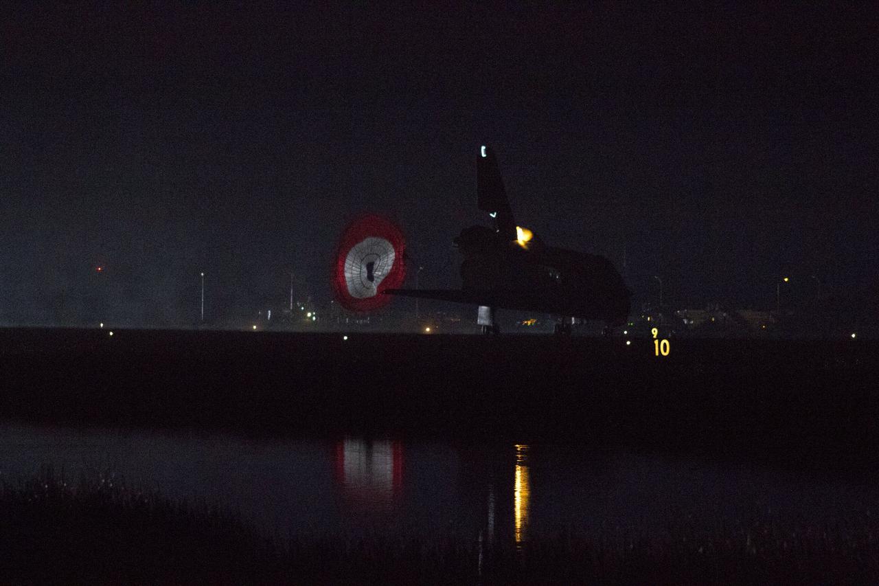 STS134-S-074 (1 June 2011) --- Space shuttle Endeavour rolls to a stop on the Shuttle Landing Facility's Runway 15 at NASA's Kennedy Space Center in Florida for the final time. Heat from the shuttle's auxiliary power units, which provide hydraulic control, can be seen at the back of Endeavour, near the vertical tail. Main gear touchdown was at 2:34:51 a.m. (EDT) on June 1, 2011, followed by nose gear touchdown at 2:35:04 a.m., and wheelstop at 2:35:36 a.m. Onboard are NASA astronauts Mark Kelly, STS-134 commander; Greg H. Johnson, pilot; Michael Fincke, Andrew Feustel, Greg Chamitoff and European Space Agency astronaut Roberto Vittori, all mission specialists. STS-134 delivered the Alpha Magnetic Spectrometer-2 (AMS) and the Express Logistics Carrier-3 (ELC-3) to the International Space Station. AMS will help researchers understand the origin of the universe and search for evidence of dark matter, strange matter and antimatter from the station. ELC-3 carried spare parts that will sustain station operations once the shuttles are retired from service. STS-134 was the 25th and final flight for Endeavour, which has spent 299 days in space, orbited Earth 4,671 times and traveled 122,883,151 miles. Photo credit: NASA