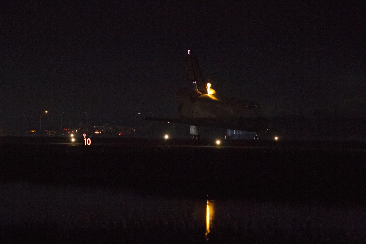 STS134-S-076 (1 June 2011) --- Heat from space shuttle Endeavour's auxiliary power units, which provide hydraulic control, can be seen at the back of the shuttle, near the vertical tail. Endeavour landed for the final time on the Shuttle Landing Facility's Runway 15 at NASA's Kennedy Space Center in Florida, marking the 24th night landing of the Space Shuttle Program. Main gear touchdown was at 2:34:51 a.m. (EDT) on June 1, 2011, followed by nose gear touchdown at 2:35:04 a.m., and wheelstop at 2:35:36 a.m. Onboard are NASA astronauts Mark Kelly, STS-134 commander; Greg H. Johnson, pilot; Michael Fincke, Andrew Feustel, Greg Chamitoff and European Space Agency astronaut Roberto Vittori, all mission specialists. STS-134 delivered the Alpha Magnetic Spectrometer-2 (AMS) and the Express Logistics Carrier-3 (ELC-3) to the International Space Station. AMS will help researchers understand the origin of the universe and search for evidence of dark matter, strange matter and antimatter from the station. ELC-3 carried spare parts that will sustain station operations once the shuttles are retired from service. STS-134 was the 25th and final flight for Endeavour, which has spent 299 days in space, orbited Earth 4,671 times and traveled 122,883,151 miles. Photo credit: NASA