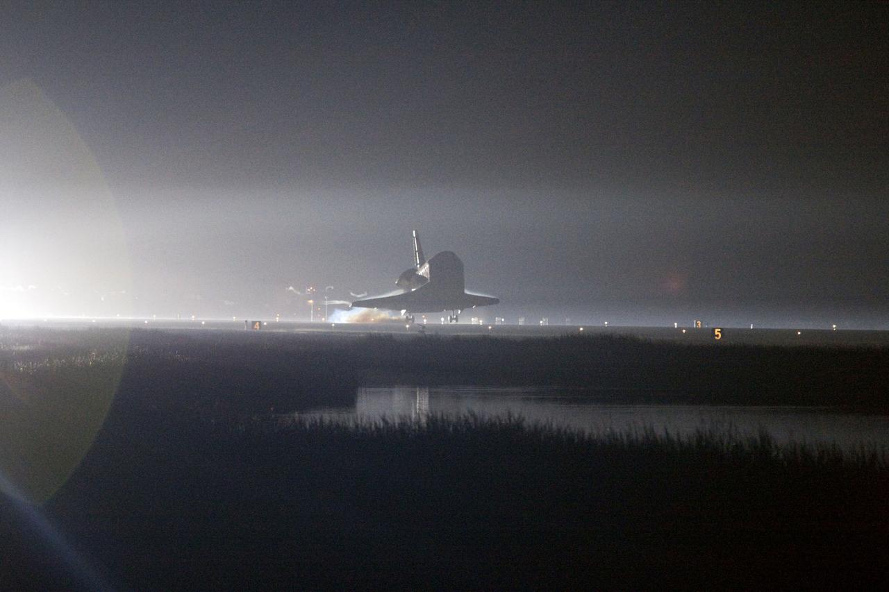 STS134-S-077 (1 June 2011) --- Xenon lights help lead space shuttle Endeavour home to NASA's Kennedy Space Center in Florida. Endeavour landed for the final time on the Shuttle Landing Facility's Runway 15, marking the 24th night landing of NASA's Space Shuttle Program. Main gear touchdown was at 2:34:51 a.m. (EDT) on June 1, 2011, followed by nose gear touchdown at 2:35:04 a.m., and wheelstop at 2:35:36 a.m. Onboard are NASA astronauts Mark Kelly, STS-134 commander; Greg H. Johnson, pilot; Michael Fincke, Andrew Feustel, Greg Chamitoff and European Space Agency astronaut Roberto Vittori, all mission specialists. STS-134 delivered the Alpha Magnetic Spectrometer-2 (AMS) and the Express Logistics Carrier-3 (ELC-3) to the International Space Station. AMS will help researchers understand the origin of the universe and search for evidence of dark matter, strange matter and antimatter from the station. ELC-3 carried spare parts that will sustain station operations once the shuttles are retired from service. STS-134 was the 25th and final flight for Endeavour, which has spent 299 days in space, orbited Earth 4,671 times and traveled 122,883,151 miles. Photo credit: NASA