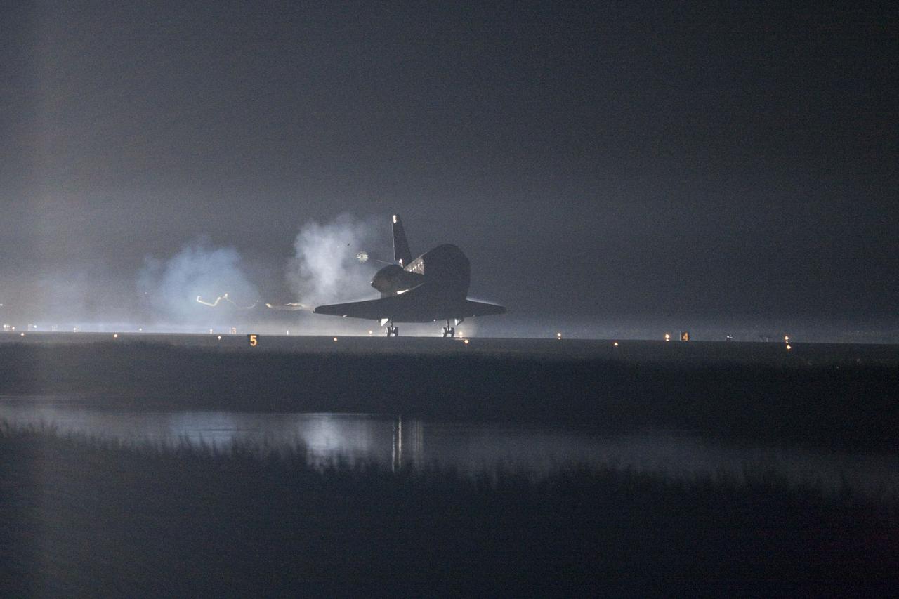 STS134-S-078 (1 June 2011) --- Xenon lights help lead space shuttle Endeavour home to NASA's Kennedy Space Center in Florida. Endeavour landed for the final time on the Shuttle Landing Facility's Runway 15, marking the 24th night landing of NASA's Space Shuttle Program. Main gear touchdown was at 2:34:51 a.m. (EDT) on June 1, 2011, followed by nose gear touchdown at 2:35:04 a.m., and wheelstop at 2:35:36 a.m. Onboard are NASA astronauts Mark Kelly, STS-134 commander; Greg H. Johnson, pilot; Michael Fincke, Andrew Feustel, Greg Chamitoff and European Space Agency astronaut Roberto Vittori, all mission specialists. STS-134 delivered the Alpha Magnetic Spectrometer-2 (AMS) and the Express Logistics Carrier-3 (ELC-3) to the International Space Station. AMS will help researchers understand the origin of the universe and search for evidence of dark matter, strange matter and antimatter from the station. ELC-3 carried spare parts that will sustain station operations once the shuttles are retired from service. STS-134 was the 25th and final flight for Endeavour, which has spent 299 days in space, orbited Earth 4,671 times and traveled 122,883,151 miles. Photo credit: NASA