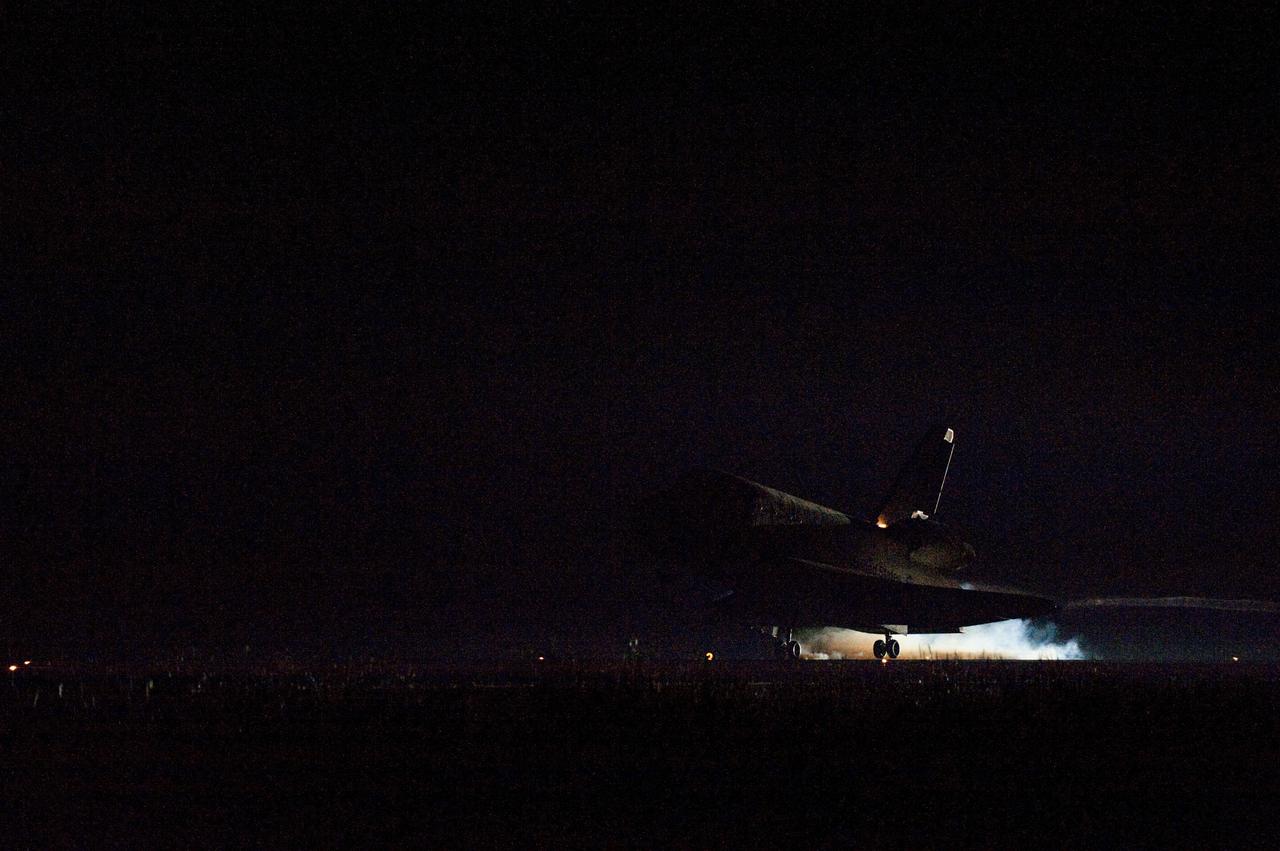 STS134-S-081 (1 June 2011) --- Heat from space shuttle Endeavour's auxiliary power units, which provide hydraulic control, can be seen at the back of the shuttle, near the vertical tail. Endeavour landed for the final time on the Shuttle Landing Facility's Runway 15 at NASA's Kennedy Space Center in Florida, marking the 24th night landing of the Space Shuttle Program. Main gear touchdown was at 2:34:51 a.m. (EDT) on June 1, 2011, followed by nose gear touchdown at 2:35:04 a.m., and wheelstop at 2:35:36 a.m. Onboard are NASA astronauts Mark Kelly, STS-134 commander; Greg H. Johnson, pilot; Michael Fincke, Andrew Feustel, Greg Chamitoff and European Space Agency astronaut Roberto Vittori, all mission specialists. STS-134 delivered the Alpha Magnetic Spectrometer-2 (AMS) and the Express Logistics Carrier-3 (ELC-3) to the International Space Station. AMS will help researchers understand the origin of the universe and search for evidence of dark matter, strange matter and antimatter from the station. ELC-3 carried spare parts that will sustain station operations once the shuttles are retired from service. STS-134 was the 25th and final flight for Endeavour, which has spent 299 days in space, orbited Earth 4,671 times and traveled 122,883,151 miles. Photo credit: NASA