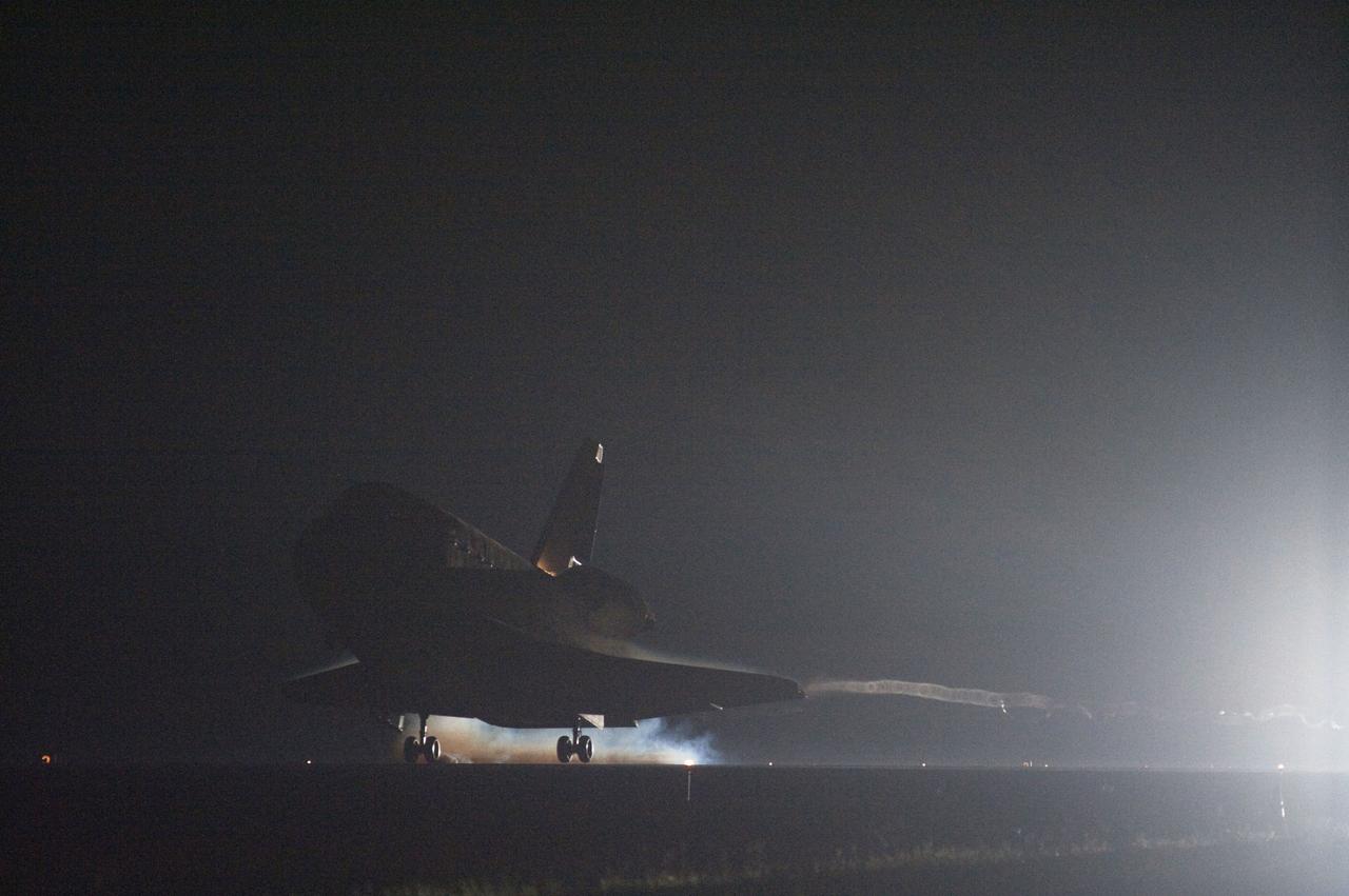 STS134-S-109 (1 June 2011) --- Streams of smoke trail from the main landing gear tires as space shuttle Endeavour touches down on the Shuttle Landing Facility's Runway 15 at NASA's Kennedy Space Center in Florida for the final time marking the 24th night landing of NASA's Space Shuttle Program. Main gear touchdown was at 2:34:51 a.m. (EDT) on June 1, 2011, followed by nose gear touchdown at 2:35:04 a.m., and wheelstop at 2:35:36 a.m. Onboard are NASA astronauts Mark Kelly, STS-134 commander; Greg H. Johnson, pilot; Michael Fincke, Andrew Feustel, Greg Chamitoff and European Space Agency astronaut Roberto Vittori, all mission specialists. STS-134 delivered the Alpha Magnetic Spectrometer-2 (AMS) and the Express Logistics Carrier-3 (ELC-3) to the International Space Station. AMS will help researchers understand the origin of the universe and search for evidence of dark matter, strange matter and antimatter from the station. ELC-3 carried spare parts that will sustain station operations once the shuttles are retired from service. STS-134 was the 25th and final flight for Endeavour, which has spent 299 days in space, orbited Earth 4,671 times and traveled 122,883,151 miles. Photo credit: NASA
