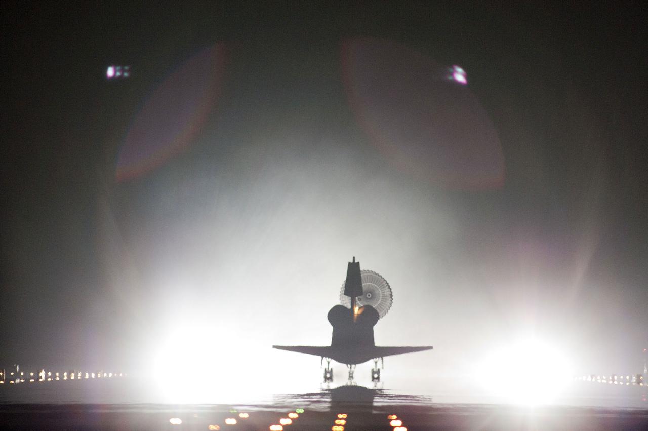 STS134-S-114 (1 June 2011) --- Xenon lights help lead space shuttle Endeavour home to NASA's Kennedy Space Center in Florida. Endeavour landed for the final time on the Shuttle Landing Facility's Runway 15, marking the 24th night landing of NASA's Space Shuttle Program. Main gear touchdown was at 2:34:51 a.m. (EDT) on June 1, 2011, followed by nose gear touchdown at 2:35:04 a.m., and wheelstop at 2:35:36 a.m. Onboard are NASA astronauts Mark Kelly, STS-134 commander; Greg H. Johnson, pilot; Michael Fincke, Andrew Feustel, Greg Chamitoff and European Space Agency astronaut Roberto Vittori, all mission specialists. STS-134 delivered the Alpha Magnetic Spectrometer-2 (AMS) and the Express Logistics Carrier-3 (ELC-3) to the International Space Station. AMS will help researchers understand the origin of the universe and search for evidence of dark matter, strange matter and antimatter from the station. ELC-3 carried spare parts that will sustain station operations once the shuttles are retired from service. STS-134 was the 25th and final flight for Endeavour, which has spent 299 days in space, orbited Earth 4,671 times and traveled 122,883,151 miles. Photo credit: NASA