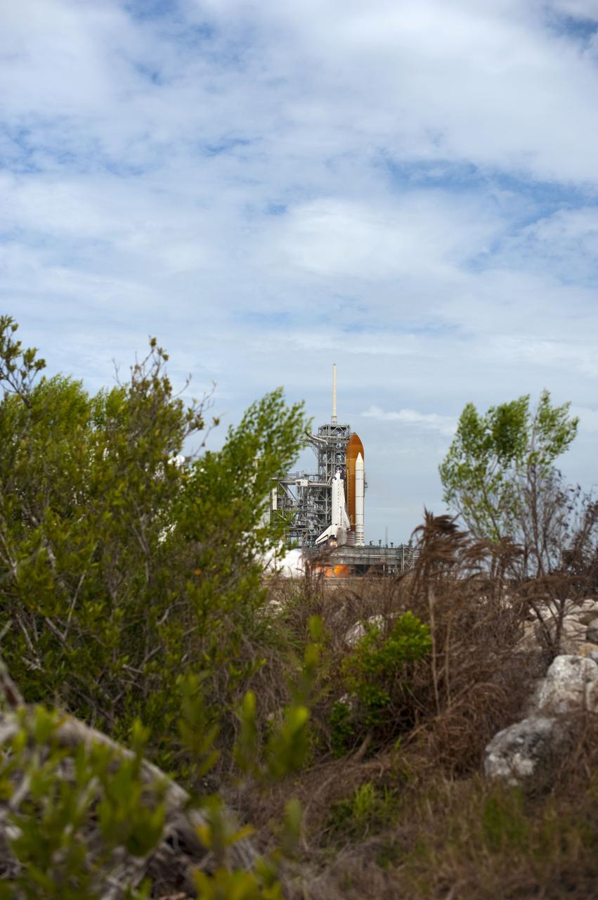 STS135-S-068 (8 July 2011) --- Space shuttle Atlantis and its four-member STS-135 crew head toward Earth orbit and rendezvous with the International Space Station. Liftoff was at 11:29 a.m. (EDT) on July 8, 2011 from Launch Pad 39A at NASA's Kennedy Space Center. Onboard are NASA astronauts Chris Ferguson, commander; Doug Hurley, pilot; Sandy Magnus and Rex Walheim, both mission specialists. STS-135 will deliver the Raffaello multi-purpose logistics module packed with supplies and spare parts for the space station. Atlantis also carries the Robotic Refueling Mission experiment that will investigate the potential for robotically refueling existing satellites in orbit. In addition, Atlantis will return with a failed ammonia pump module to help NASA better understand the failure mechanism and improve pump designs for future systems. STS-135 will be the 33rd flight of Atlantis, the 37th shuttle mission to the space station, and the 135th and final mission of NASA's Space Shuttle Program. Photo credit: NASA