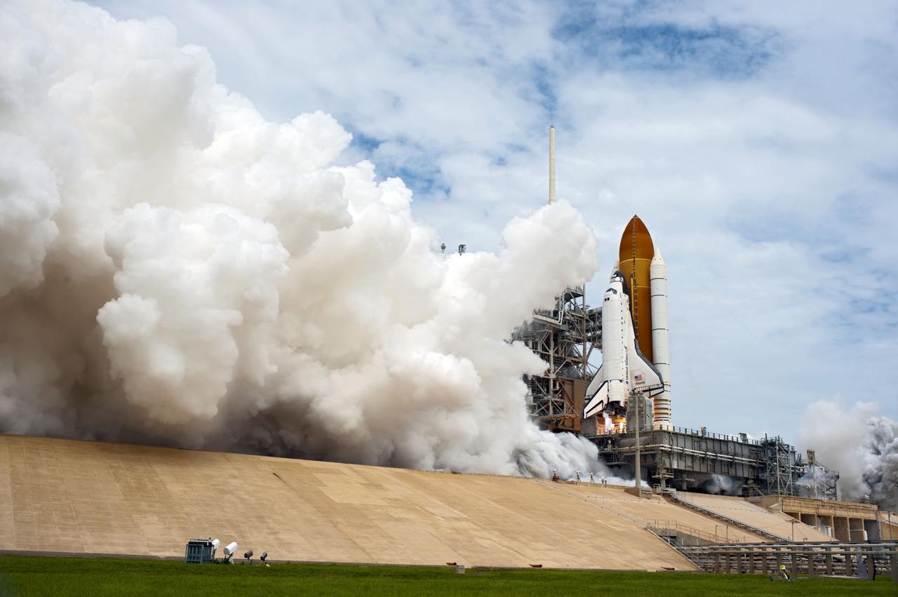 STS135-S-081 (8 July 2011) --- At NASA's Kennedy Space Center in Florida, space shuttle Atlantis' main engines and solid rocket boosters ignite on Launch Pad 39A leaving behind a billow of steam as it lifts off on its STS-135 mission to the International Space Station. Onboard are NASA astronauts Chris Ferguson, commander; Doug Hurley, pilot; Sandy Magnus and Rex Walheim, both mission specialists. STS-135 will deliver the Raffaello multi-purpose logistics module packed with supplies and spare parts for the space station. Atlantis also carries the Robotic Refueling Mission experiment that will investigate the potential for robotically refueling existing satellites in orbit. In addition, Atlantis will return with a failed ammonia pump module to help NASA better understand the failure mechanism and improve pump designs for future systems. STS-135 will be the 33rd flight of Atlantis, the 37th shuttle mission to the space station, and the 135th and final mission of NASA's Space Shuttle Program. Photo credit: NASA