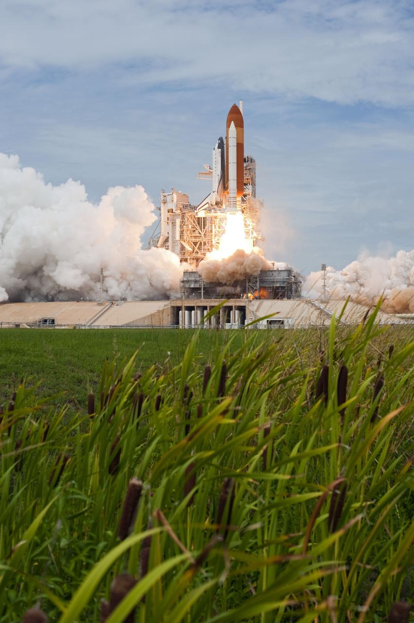STS135-S-095 (8 July 2011) --- Space shuttle Atlantis and its four-member STS-135 crew head toward Earth orbit and rendezvous with the International Space Station. Liftoff was at 11:29 a.m. (EDT) on July 8, 2011 from Launch Pad 39A at NASA's Kennedy Space Center. Onboard are NASA astronauts Chris Ferguson, commander; Doug Hurley, pilot; Sandy Magnus and Rex Walheim, both mission specialists. STS-135 will deliver the Raffaello multi-purpose logistics module packed with supplies and spare parts for the space station. Atlantis also carries the Robotic Refueling Mission experiment that will investigate the potential for robotically refueling existing satellites in orbit. In addition, Atlantis will return with a failed ammonia pump module to help NASA better understand the failure mechanism and improve pump designs for future systems. STS-135 will be the 33rd flight of Atlantis, the 37th shuttle mission to the space station, and the 135th and final mission of NASA's Space Shuttle Program. Photo credit: NASA