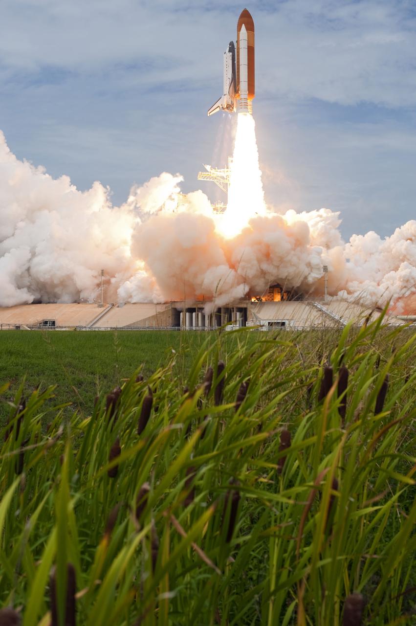STS135-S-097 (8 July 2011) --- Space shuttle Atlantis and its four-member STS-135 crew head toward Earth orbit and rendezvous with the International Space Station. Liftoff was at 11:29 a.m. (EDT) on July 8, 2011 from Launch Pad 39A at NASA's Kennedy Space Center. Onboard are NASA astronauts Chris Ferguson, commander; Doug Hurley, pilot; Sandy Magnus and Rex Walheim, both mission specialists. STS-135 will deliver the Raffaello multi-purpose logistics module packed with supplies and spare parts for the space station. Atlantis also carries the Robotic Refueling Mission experiment that will investigate the potential for robotically refueling existing satellites in orbit. In addition, Atlantis will return with a failed ammonia pump module to help NASA better understand the failure mechanism and improve pump designs for future systems. STS-135 will be the 33rd flight of Atlantis, the 37th shuttle mission to the space station, and the 135th and final mission of NASA's Space Shuttle Program. Photo credit: NASA