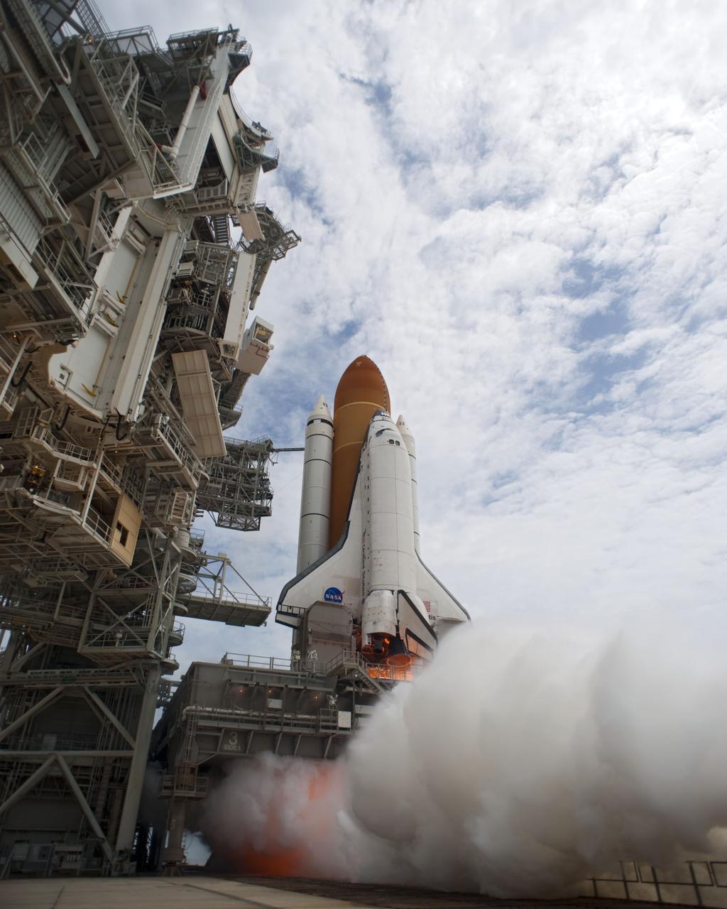 STS135-S-101 (8 July 2011) --- Smoke and steam begin to billow outward as space shuttle Atlantis' main engines are ignited for liftoff at Launch Pad 39A at NASA's Kennedy Space Center in Florida as it begins its STS-135 mission to the International Space Station. Liftoff was at 11:29 a.m. (EDT) on July 8, 2011. Onboard are NASA astronauts Chris Ferguson, commander; Doug Hurley, pilot; Sandy Magnus and Rex Walheim, both mission specialists. STS-135 will deliver the Raffaello multi-purpose logistics module packed with supplies and spare parts for the space station. Atlantis also carries the Robotic Refueling Mission experiment that will investigate the potential for robotically refueling existing satellites in orbit. In addition, Atlantis will return with a failed ammonia pump module to help NASA better understand the failure mechanism and improve pump designs for future systems. STS-135 will be the 33rd flight of Atlantis, the 37th shuttle mission to the space station, and the 135th and final mission of NASA's Space Shuttle Program. Photo credit: NASA