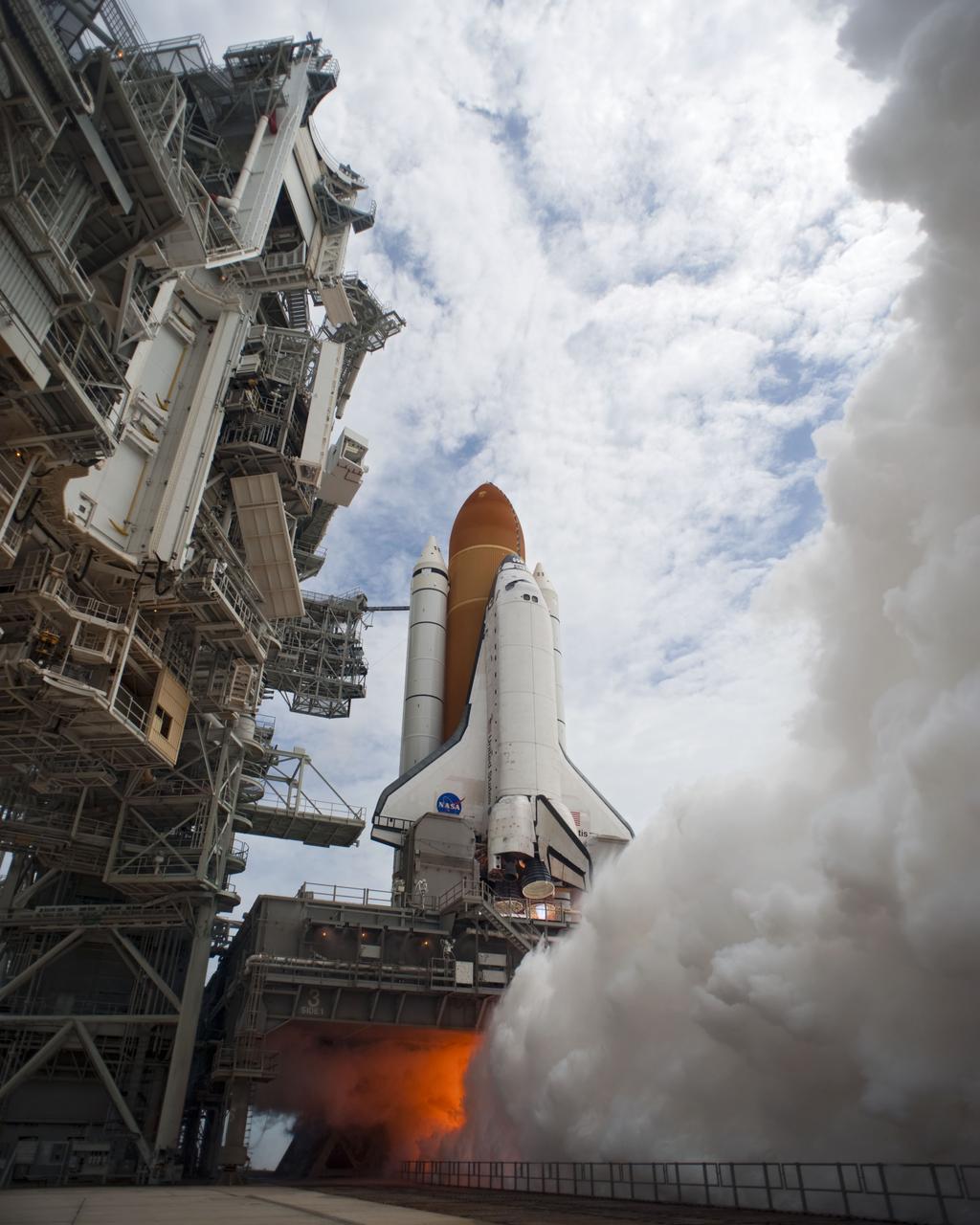 STS135-S-102 (8 July 2011) --- Smoke and steam begin to billow outward as space shuttle Atlantis' main engines are ignited for liftoff at Launch Pad 39A at NASA's Kennedy Space Center in Florida as it begins its STS-135 mission to the International Space Station. Liftoff was at 11:29 a.m. (EDT) on July 8, 2011. Onboard are NASA astronauts Chris Ferguson, commander; Doug Hurley, pilot; Sandy Magnus and Rex Walheim, both mission specialists. STS-135 will deliver the Raffaello multi-purpose logistics module packed with supplies and spare parts for the space station. Atlantis also carries the Robotic Refueling Mission experiment that will investigate the potential for robotically refueling existing satellites in orbit. In addition, Atlantis will return with a failed ammonia pump module to help NASA better understand the failure mechanism and improve pump designs for future systems. STS-135 will be the 33rd flight of Atlantis, the 37th shuttle mission to the space station, and the 135th and final mission of NASA's Space Shuttle Program. Photo credit: NASA