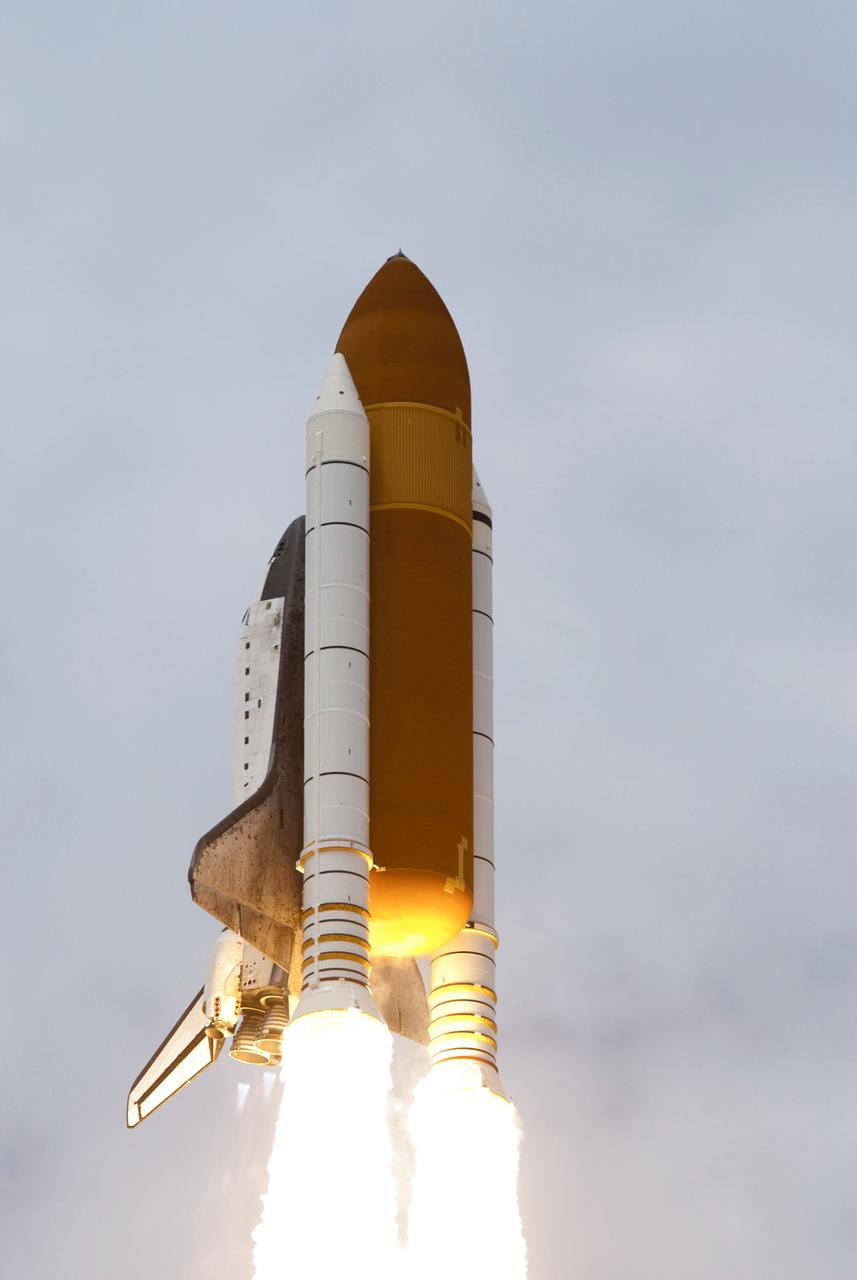 STS135-S-127 (8 July 2011) --- Space shuttle Atlantis and its four-member STS-135 crew head toward Earth orbit and rendezvous with the International Space Station. Liftoff was at 11:29 a.m. (EDT) on July 8, 2011 from Launch Pad 39A at NASA's Kennedy Space Center. Onboard are NASA astronauts Chris Ferguson, commander; Doug Hurley, pilot; Sandy Magnus and Rex Walheim, both mission specialists. STS-135 will deliver the Raffaello multi-purpose logistics module packed with supplies and spare parts for the space station. Atlantis also carries the Robotic Refueling Mission experiment that will investigate the potential for robotically refueling existing satellites in orbit. In addition, Atlantis will return with a failed ammonia pump module to help NASA better understand the failure mechanism and improve pump designs for future systems. STS-135 will be the 33rd flight of Atlantis, the 37th shuttle mission to the space station, and the 135th and final mission of NASA's Space Shuttle Program. Photo credit: NASA