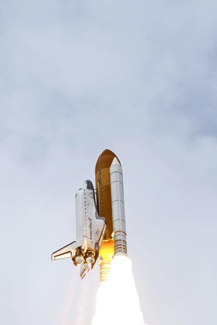 STS135-S-129 (8 July 2011) --- Space shuttle Atlantis and its four-member STS-135 crew head toward Earth orbit and rendezvous with the International Space Station. Liftoff was at 11:29 a.m. (EDT) on July 8, 2011 from Launch Pad 39A at NASA's Kennedy Space Center. Onboard are NASA astronauts Chris Ferguson, commander; Doug Hurley, pilot; Sandy Magnus and Rex Walheim, both mission specialists. STS-135 will deliver the Raffaello multi-purpose logistics module packed with supplies and spare parts for the space station. Atlantis also carries the Robotic Refueling Mission experiment that will investigate the potential for robotically refueling existing satellites in orbit. In addition, Atlantis will return with a failed ammonia pump module to help NASA better understand the failure mechanism and improve pump designs for future systems. STS-135 will be the 33rd flight of Atlantis, the 37th shuttle mission to the space station, and the 135th and final mission of NASA's Space Shuttle Program. Photo credit: NASA