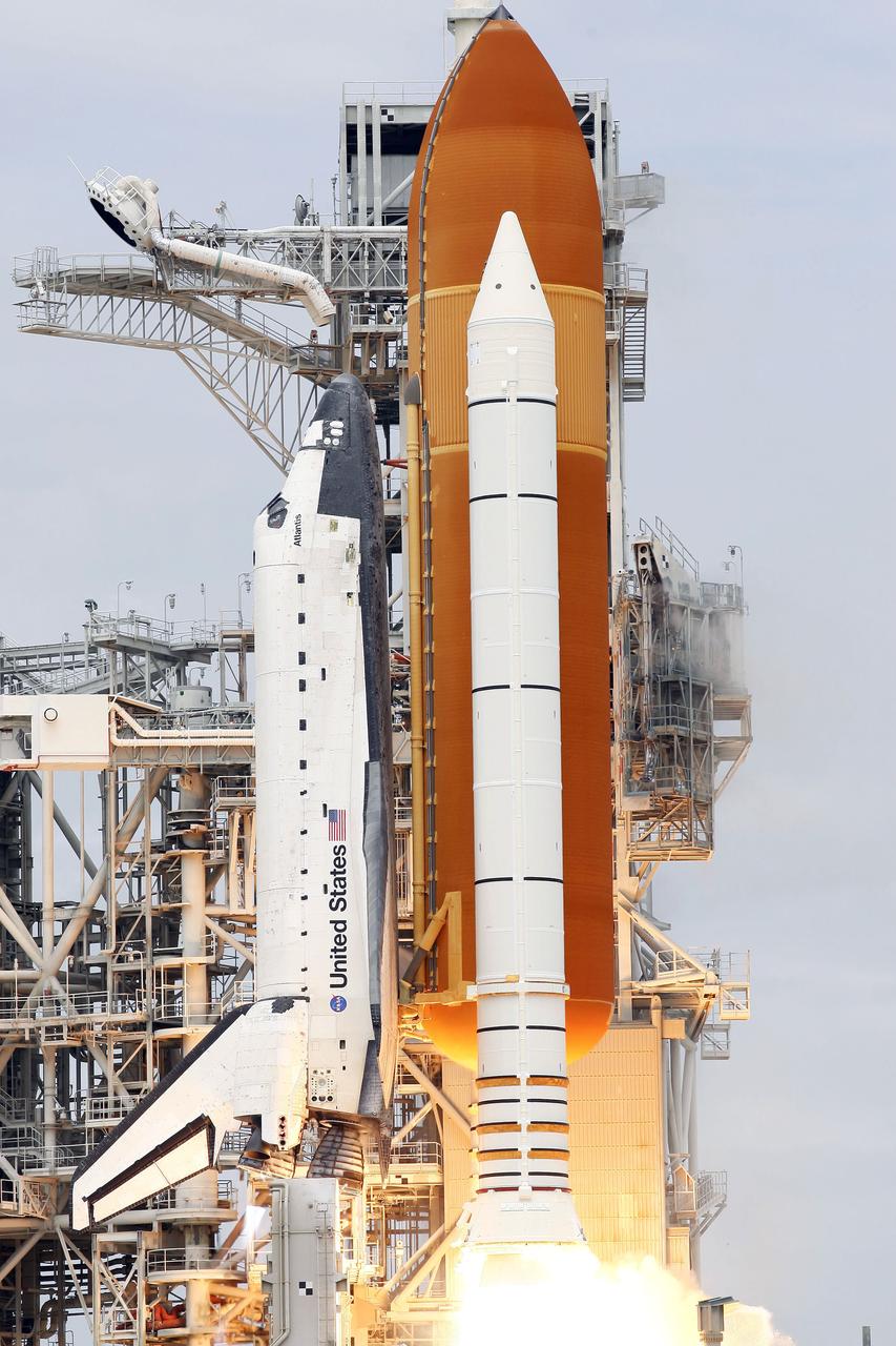STS135-S-134 (8 July 2011) --- At NASA's Kennedy Space Center in Florida, space shuttle Atlantis' main engines and solid rocket boosters ignite on Launch Pad 39A as it lifts off on its STS-135 mission to the International Space Station. Onboard are NASA astronauts Chris Ferguson, commander; Doug Hurley, pilot; Sandy Magnus and Rex Walheim, both mission specialists. STS-135 will deliver the Raffaello multi-purpose logistics module packed with supplies and spare parts for the space station. Atlantis also carries the Robotic Refueling Mission experiment that will investigate the potential for robotically refueling existing satellites in orbit. In addition, Atlantis will return with a failed ammonia pump module to help NASA better understand the failure mechanism and improve pump designs for future systems. STS-135 will be the 33rd flight of Atlantis, the 37th shuttle mission to the space station, and the 135th and final mission of NASA's Space Shuttle Program. Photo credit: NASA
