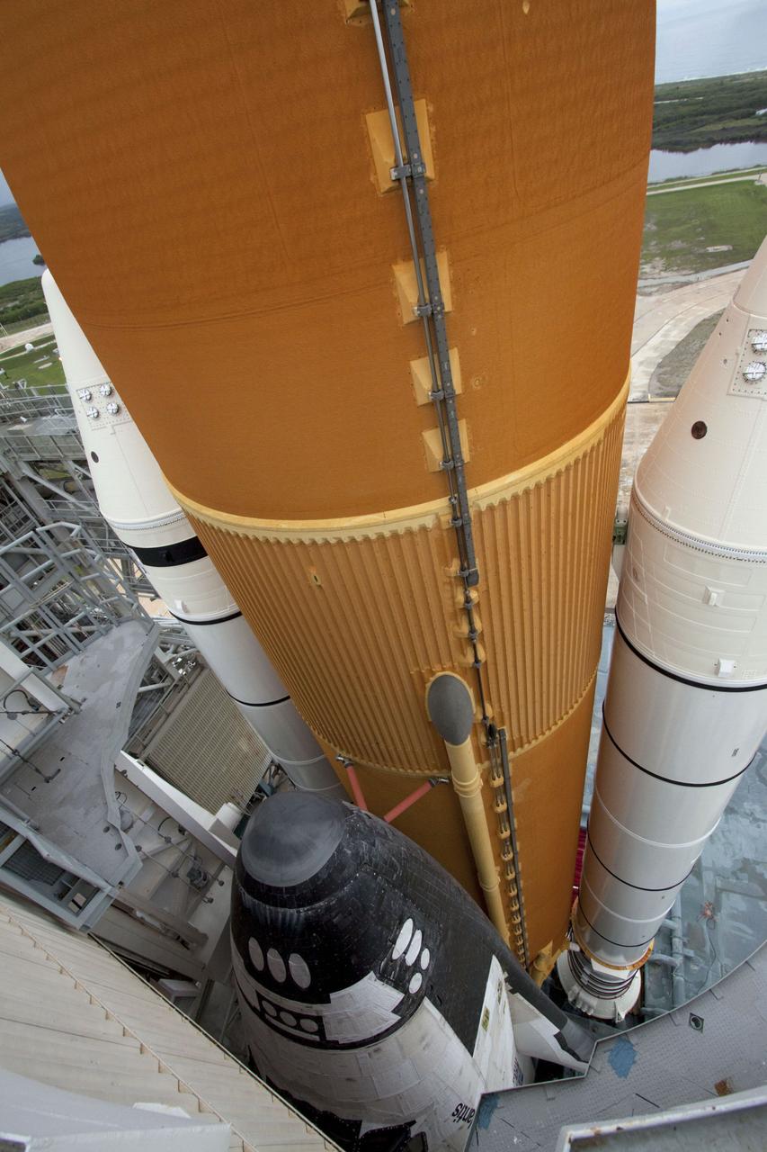 STS135-S-150 (8 July 2011) --- Space shuttle Atlantis is pictured on Launch Pad 39A at NASA's Kennedy Space Center in Florida following the move of the rotating service structure (RSS). The structure provides weather protection and access to the shuttle while it awaits liftoff on the pad. RSS "rollback" marks a major milestone in Atlantis' STS-135 mission countdown. Liftoff was at 11:29 a.m. (EDT) on July 8, 2011. Onboard are NASA astronauts Chris Ferguson, commander; Doug Hurley, pilot; Sandy Magnus and Rex Walheim, both mission specialists. STS-135 will deliver the Raffaello multi-purpose logistics module packed with supplies and spare parts for the space station. Atlantis also carries the Robotic Refueling Mission experiment that will investigate the potential for robotically refueling existing satellites in orbit. In addition, Atlantis will return with a failed ammonia pump module to help NASA better understand the failure mechanism and improve pump designs for future systems. STS-135 will be the 33rd flight of Atlantis, the 37th shuttle mission to the space station, and the 135th and final mission of NASA's Space Shuttle Program. Photo credit: NASA
