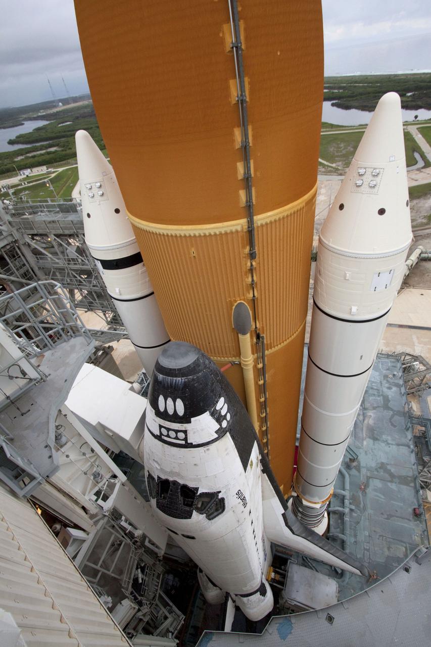STS135-S-152 (8 July 2011) --- Space shuttle Atlantis is pictured on Launch Pad 39A at NASA's Kennedy Space Center in Florida following the move of the rotating service structure (RSS). The structure provides weather protection and access to the shuttle while it awaits liftoff on the pad. RSS "rollback" marks a major milestone in Atlantis' STS-135 mission countdown. Liftoff was at 11:29 a.m. (EDT) on July 8, 2011. Onboard are NASA astronauts Chris Ferguson, commander; Doug Hurley, pilot; Sandy Magnus and Rex Walheim, both mission specialists. STS-135 will deliver the Raffaello multi-purpose logistics module packed with supplies and spare parts for the space station. Atlantis also carries the Robotic Refueling Mission experiment that will investigate the potential for robotically refueling existing satellites in orbit. In addition, Atlantis will return with a failed ammonia pump module to help NASA better understand the failure mechanism and improve pump designs for future systems. STS-135 will be the 33rd flight of Atlantis, the 37th shuttle mission to the space station, and the 135th and final mission of NASA's Space Shuttle Program. Photo credit: NASA