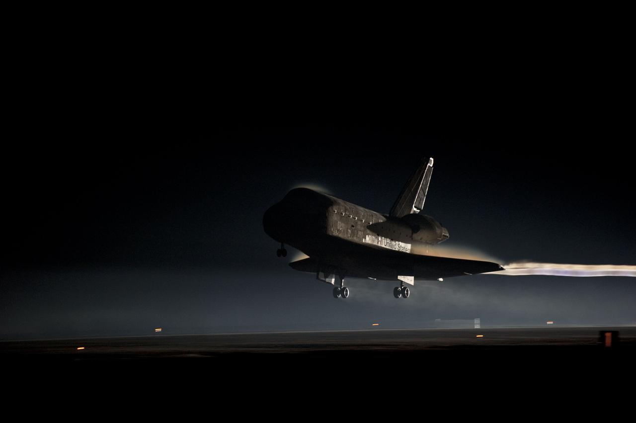 STS135-S-160 (21 July 2011) --- Ribbons of steam and smoke trail space shuttle Atlantis as it nears touchdown on the Shuttle Landing Facility's Runway 15 at NASA's Kennedy Space Center in Florida for the final time. Securing the space shuttle fleet's place in history, Atlantis marked the 26th nighttime landing of NASA's Space Shuttle Program and the 78th landing at Kennedy. Main gear touchdown was at 5:57:00 a.m. (EDT) on July 21, 2011, followed by nose gear touchdown at 5:57:20 a.m., and wheelstop at 5:57:54 a.m. Onboard are NASA astronauts Chris Ferguson, STS-135 commander; Doug Hurley, pilot; Sandy Magnus and Rex Walheim, both mission specialists. On the 37th shuttle mission to the International Space Station, STS-135 delivered more than 9,400 pounds of spare parts, equipment and supplies in the Raffaello multi-purpose logistics module that will sustain station operations for the next year. STS-135 was the 33rd and final flight for Atlantis, which has spent 307 days in space, orbited Earth 4,848 times and traveled 125,935,769 miles. Photo credit: NASA