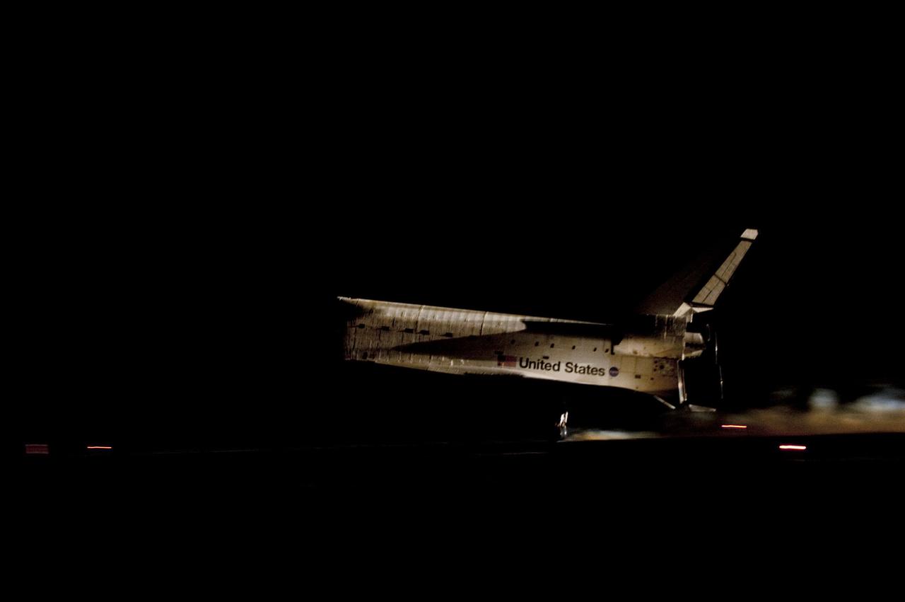 STS135-S-161 (21 July 2011) --- Space shuttle Atlantis' bright-white, iconic frame illuminates the darkness as it touches down on the Shuttle Landing Facility's Runway 15 at NASA's Kennedy Space Center in Florida for the final time. Securing the space shuttle fleet's place in history, Atlantis marked the 26th nighttime landing of NASA's Space Shuttle Program and the 78th landing at Kennedy. Main gear touchdown was at 5:57:00 a.m. (EDT) on July 21, 2011, followed by nose gear touchdown at 5:57:20 a.m., and wheelstop at 5:57:54 a.m. Onboard are NASA astronauts Chris Ferguson, STS-135 commander; Doug Hurley, pilot; Sandy Magnus and Rex Walheim, both mission specialists. On the 37th shuttle mission to the International Space Station, STS-135 delivered more than 9,400 pounds of spare parts, equipment and supplies in the Raffaello multi-purpose logistics module that will sustain station operations for the next year. STS-135 was the 33rd and final flight for Atlantis, which has spent 307 days in space, orbited Earth 4,848 times and traveled 125,935,769 miles. Photo credit: NASA