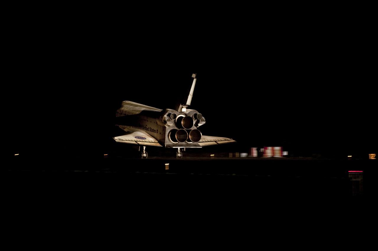 STS135-S-163 (21 July 2011) --- Space shuttle Atlantis' bright-white, iconic frame illuminates the darkness as it touches down on the Shuttle Landing Facility's Runway 15 at NASA's Kennedy Space Center in Florida for the final time. Securing the space shuttle fleet's place in history, Atlantis marked the 26th nighttime landing of NASA's Space Shuttle Program and the 78th landing at Kennedy. Main gear touchdown was at 5:57:00 a.m. (EDT) on July 21, 2011, followed by nose gear touchdown at 5:57:20 a.m., and wheelstop at 5:57:54 a.m. Onboard are NASA astronauts Chris Ferguson, STS-135 commander; Doug Hurley, pilot; Sandy Magnus and Rex Walheim, both mission specialists. On the 37th shuttle mission to the International Space Station, STS-135 delivered more than 9,400 pounds of spare parts, equipment and supplies in the Raffaello multi-purpose logistics module that will sustain station operations for the next year. STS-135 was the 33rd and final flight for Atlantis, which has spent 307 days in space, orbited Earth 4,848 times and traveled 125,935,769 miles. Photo credit: NASA