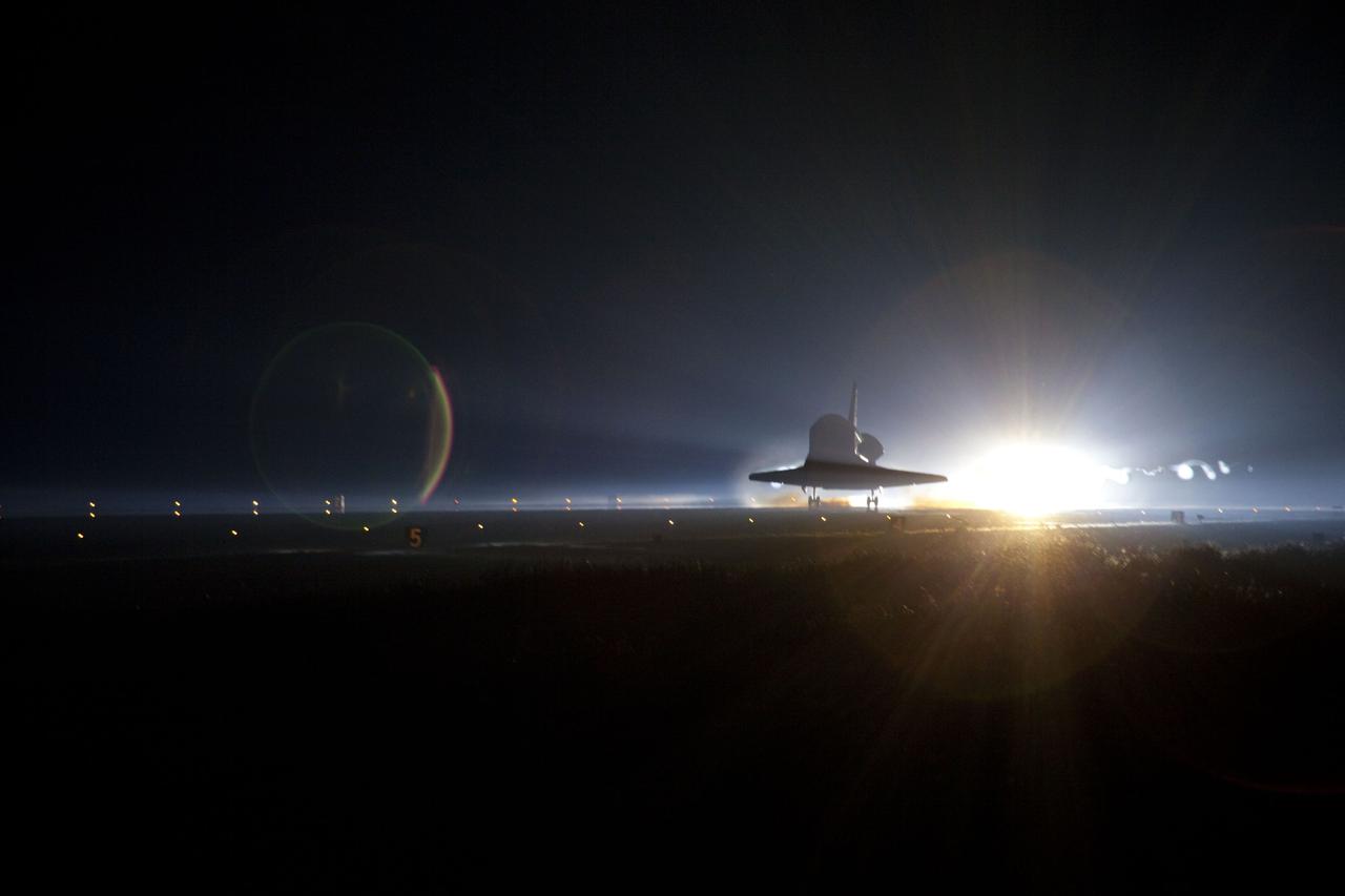 STS135-S-167 (21 July 2011) --- Xenon lights guide space shuttle Atlantis down on the Shuttle Landing Facility's Runway 15 at NASA's Kennedy Space Center in Florida for the final time. Securing the space shuttle fleet's place in history, Atlantis marked the 26th nighttime landing of NASA's Space Shuttle Program and the 78th landing at Kennedy. Main gear touchdown was at 5:57:00 a.m. (EDT) on July 21, 2011, followed by nose gear touchdown at 5:57:20 a.m., and wheelstop at 5:57:54 a.m. Onboard are NASA astronauts Chris Ferguson, STS-135 commander; Doug Hurley, pilot; Sandy Magnus and Rex Walheim, both mission specialists. On the 37th shuttle mission to the International Space Station, STS-135 delivered more than 9,400 pounds of spare parts, equipment and supplies in the Raffaello multi-purpose logistics module that will sustain station operations for the next year. STS-135 was the 33rd and final flight for Atlantis, which has spent 307 days in space, orbited Earth 4,848 times and traveled 125,935,769 miles. Photo credit: NASA