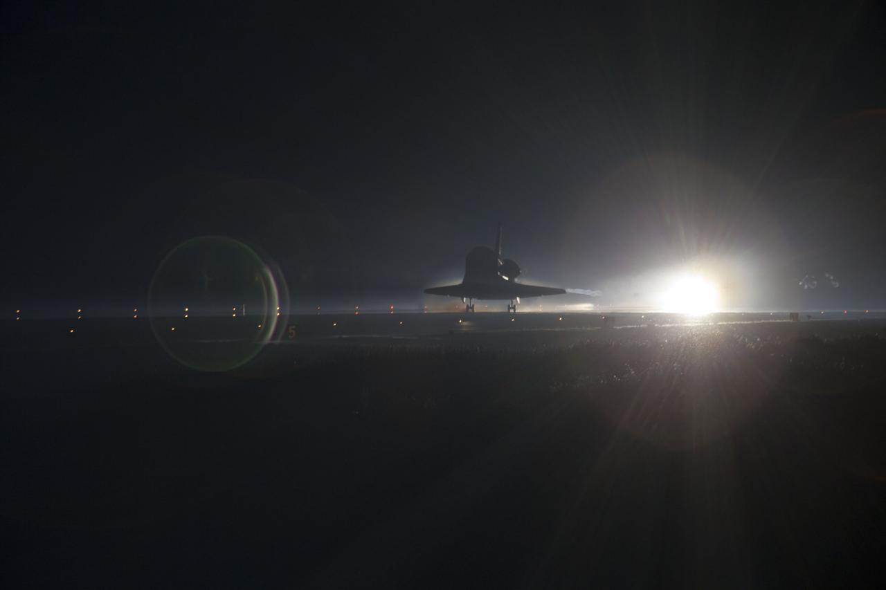 STS135-S-168 (21 July 2011) --- Xenon lights guide space shuttle Atlantis down on the Shuttle Landing Facility's Runway 15 at NASA's Kennedy Space Center in Florida for the final time. Securing the space shuttle fleet's place in history, Atlantis marked the 26th nighttime landing of NASA's Space Shuttle Program and the 78th landing at Kennedy. Main gear touchdown was at 5:57:00 a.m. (EDT) on July 21, 2011, followed by nose gear touchdown at 5:57:20 a.m., and wheelstop at 5:57:54 a.m. Onboard are NASA astronauts Chris Ferguson, STS-135 commander; Doug Hurley, pilot; Sandy Magnus and Rex Walheim, both mission specialists. On the 37th shuttle mission to the International Space Station, STS-135 delivered more than 9,400 pounds of spare parts, equipment and supplies in the Raffaello multi-purpose logistics module that will sustain station operations for the next year. STS-135 was the 33rd and final flight for Atlantis, which has spent 307 days in space, orbited Earth 4,848 times and traveled 125,935,769 miles. Photo credit: NASA