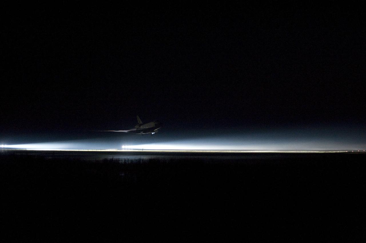 STS135-S-171 (21 July 2011) --- Xenon lights guide space shuttle Atlantis down on the Shuttle Landing Facility's Runway 15 at NASA's Kennedy Space Center in Florida for the final time. Securing the space shuttle fleet's place in history, Atlantis marked the 26th nighttime landing of NASA's Space Shuttle Program and the 78th landing at Kennedy. Main gear touchdown was at 5:57:00 a.m. (EDT) on July 21, 2011, followed by nose gear touchdown at 5:57:20 a.m., and wheelstop at 5:57:54 a.m. Onboard are NASA astronauts Chris Ferguson, STS-135 commander; Doug Hurley, pilot; Sandy Magnus and Rex Walheim, both mission specialists. On the 37th shuttle mission to the International Space Station, STS-135 delivered more than 9,400 pounds of spare parts, equipment and supplies in the Raffaello multi-purpose logistics module that will sustain station operations for the next year. STS-135 was the 33rd and final flight for Atlantis, which has spent 307 days in space, orbited Earth 4,848 times and traveled 125,935,769 miles. Photo credit: NASA