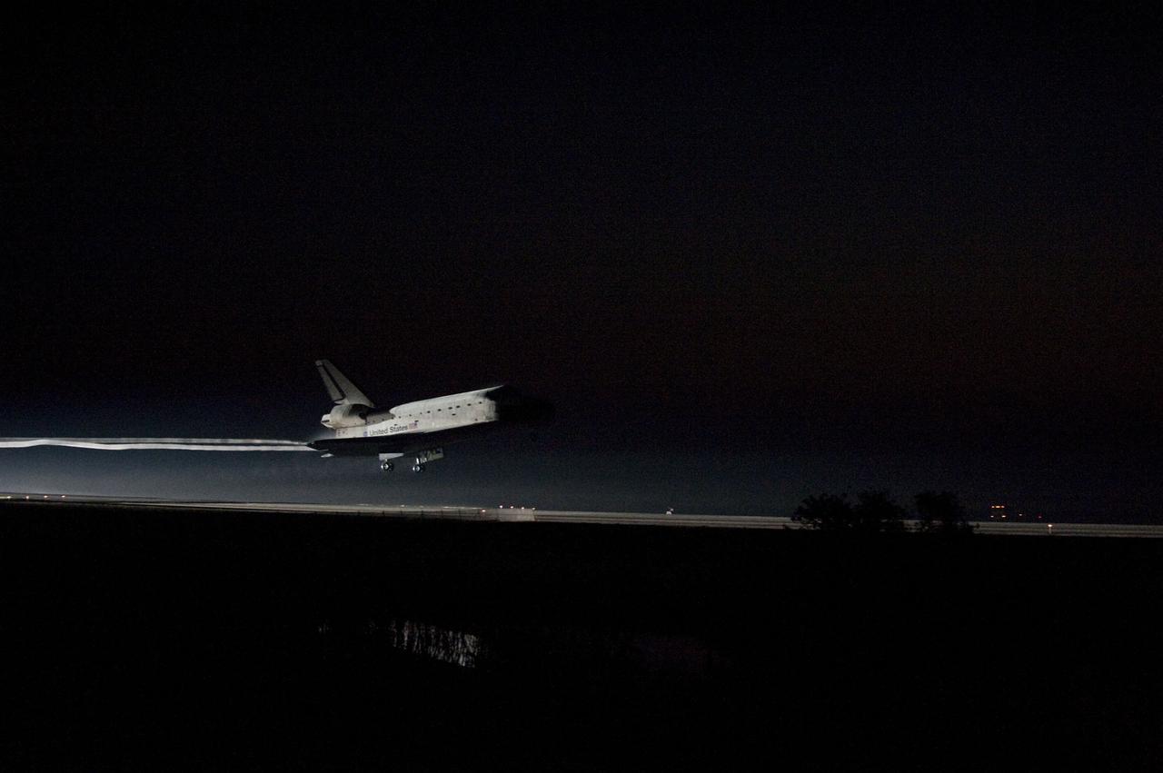 STS135-S-173 (21 July 2011) --- Xenon lights guide space shuttle Atlantis down on the Shuttle Landing Facility's Runway 15 at NASA's Kennedy Space Center in Florida for the final time. Securing the space shuttle fleet's place in history, Atlantis marked the 26th nighttime landing of NASA's Space Shuttle Program and the 78th landing at Kennedy. Main gear touchdown was at 5:57:00 a.m. (EDT) on July 21, 2011, followed by nose gear touchdown at 5:57:20 a.m., and wheelstop at 5:57:54 a.m. Onboard are NASA astronauts Chris Ferguson, STS-135 commander; Doug Hurley, pilot; Sandy Magnus and Rex Walheim, both mission specialists. On the 37th shuttle mission to the International Space Station, STS-135 delivered more than 9,400 pounds of spare parts, equipment and supplies in the Raffaello multi-purpose logistics module that will sustain station operations for the next year. STS-135 was the 33rd and final flight for Atlantis, which has spent 307 days in space, orbited Earth 4,848 times and traveled 125,935,769 miles. Photo credit: NASA