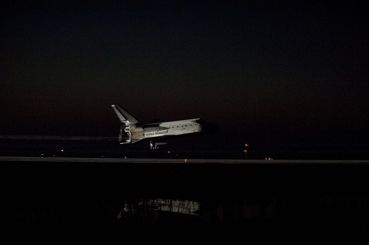 STS135-S-177 (21 July 2011) --- Space shuttle Atlantis' bright-white, iconic frame illuminates the darkness as it touches down on the Shuttle Landing Facility's Runway 15 at NASA's Kennedy Space Center in Florida for the final time. Securing the space shuttle fleet's place in history, Atlantis marked the 26th nighttime landing of NASA's Space Shuttle Program and the 78th landing at Kennedy. Main gear touchdown was at 5:57:00 a.m. (EDT) on July 21, 2011, followed by nose gear touchdown at 5:57:20 a.m., and wheelstop at 5:57:54 a.m. Onboard are NASA astronauts Chris Ferguson, STS-135 commander; Doug Hurley, pilot; Sandy Magnus and Rex Walheim, both mission specialists. On the 37th shuttle mission to the International Space Station, STS-135 delivered more than 9,400 pounds of spare parts, equipment and supplies in the Raffaello multi-purpose logistics module that will sustain station operations for the next year. STS-135 was the 33rd and final flight for Atlantis, which has spent 307 days in space, orbited Earth 4,848 times and traveled 125,935,769 miles. Photo credit: NASA