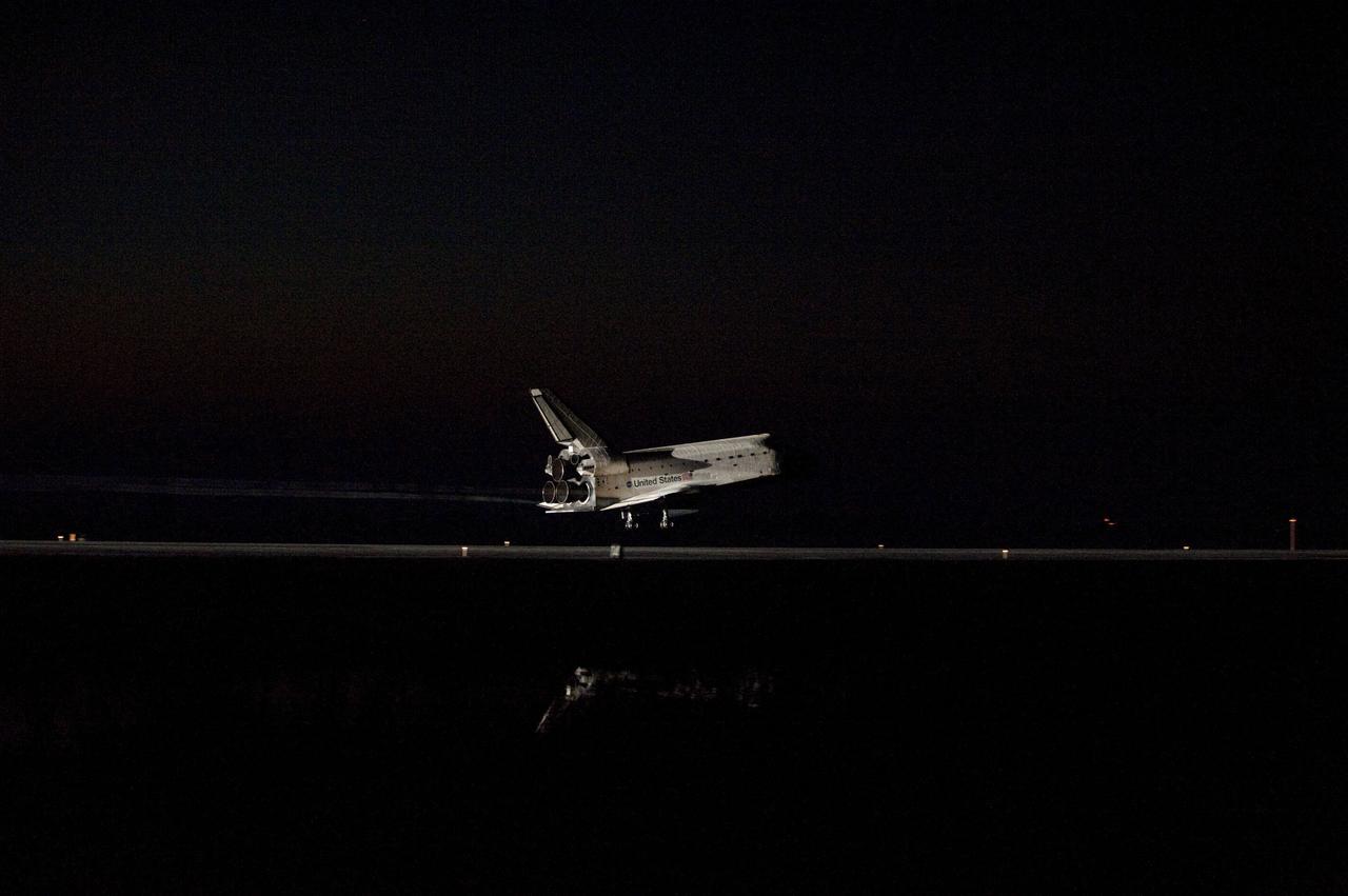 STS135-S-178 (21 July 2011) --- Space shuttle Atlantis' bright-white, iconic frame illuminates the darkness as it touches down on the Shuttle Landing Facility's Runway 15 at NASA's Kennedy Space Center in Florida for the final time. Securing the space shuttle fleet's place in history, Atlantis marked the 26th nighttime landing of NASA's Space Shuttle Program and the 78th landing at Kennedy. Main gear touchdown was at 5:57:00 a.m. (EDT) on July 21, 2011, followed by nose gear touchdown at 5:57:20 a.m., and wheelstop at 5:57:54 a.m. Onboard are NASA astronauts Chris Ferguson, STS-135 commander; Doug Hurley, pilot; Sandy Magnus and Rex Walheim, both mission specialists. On the 37th shuttle mission to the International Space Station, STS-135 delivered more than 9,400 pounds of spare parts, equipment and supplies in the Raffaello multi-purpose logistics module that will sustain station operations for the next year. STS-135 was the 33rd and final flight for Atlantis, which has spent 307 days in space, orbited Earth 4,848 times and traveled 125,935,769 miles. Photo credit: NASA