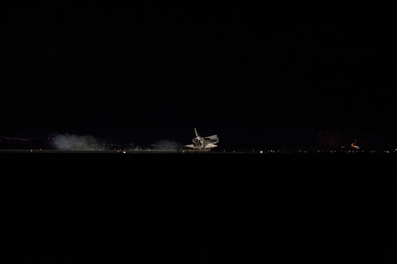 STS135-S-181 (21 July 2011) --- Space shuttle Atlantis' bright-white, iconic frame illuminates the darkness as it touches down on the Shuttle Landing Facility's Runway 15 at NASA's Kennedy Space Center in Florida for the final time. Securing the space shuttle fleet's place in history, Atlantis marked the 26th nighttime landing of NASA's Space Shuttle Program and the 78th landing at Kennedy. Main gear touchdown was at 5:57:00 a.m. (EDT) on July 21, 2011, followed by nose gear touchdown at 5:57:20 a.m., and wheelstop at 5:57:54 a.m. Onboard are NASA astronauts Chris Ferguson, STS-135 commander; Doug Hurley, pilot; Sandy Magnus and Rex Walheim, both mission specialists. On the 37th shuttle mission to the International Space Station, STS-135 delivered more than 9,400 pounds of spare parts, equipment and supplies in the Raffaello multi-purpose logistics module that will sustain station operations for the next year. STS-135 was the 33rd and final flight for Atlantis, which has spent 307 days in space, orbited Earth 4,848 times and traveled 125,935,769 miles. Photo credit: NASA