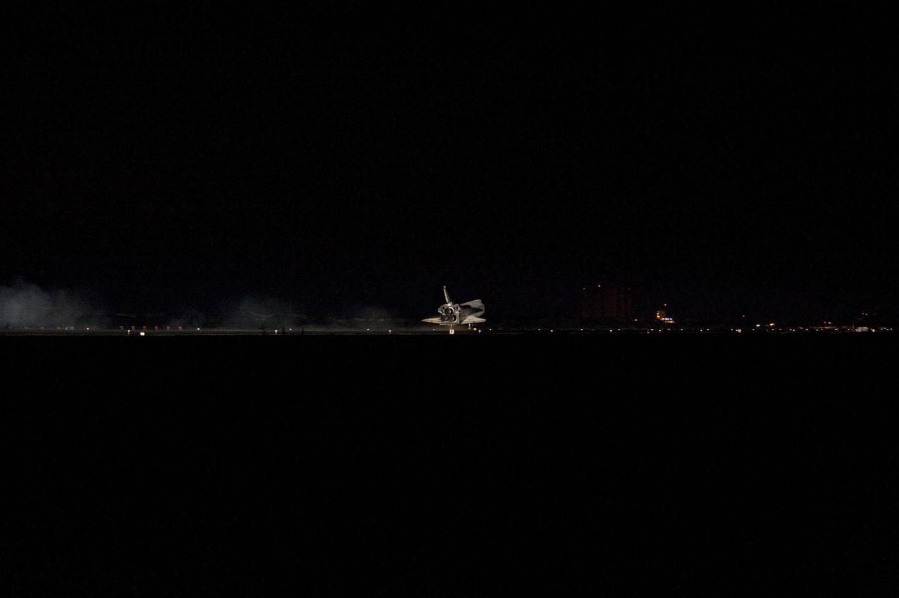 STS135-S-182 (21 July 2011) --- Space shuttle Atlantis' bright-white, iconic frame illuminates the darkness as it touches down on the Shuttle Landing Facility's Runway 15 at NASA's Kennedy Space Center in Florida for the final time. Securing the space shuttle fleet's place in history, Atlantis marked the 26th nighttime landing of NASA's Space Shuttle Program and the 78th landing at Kennedy. Main gear touchdown was at 5:57:00 a.m. (EDT) on July 21, 2011, followed by nose gear touchdown at 5:57:20 a.m., and wheelstop at 5:57:54 a.m. Onboard are NASA astronauts Chris Ferguson, STS-135 commander; Doug Hurley, pilot; Sandy Magnus and Rex Walheim, both mission specialists. On the 37th shuttle mission to the International Space Station, STS-135 delivered more than 9,400 pounds of spare parts, equipment and supplies in the Raffaello multi-purpose logistics module that will sustain station operations for the next year. STS-135 was the 33rd and final flight for Atlantis, which has spent 307 days in space, orbited Earth 4,848 times and traveled 125,935,769 miles. Photo credit: NASA