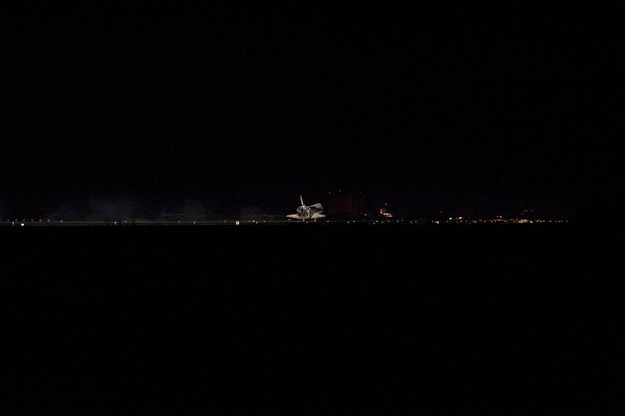 STS135-S-183 (21 July 2011) --- Space shuttle Atlantis' three main engines glow a red hue in the spacecraft's tail end as it touches down on the Shuttle Landing Facility's Runway 15 at NASA's Kennedy Space Center in Florida for the final time. Securing the space shuttle fleet's place in history, Atlantis marked the 26th nighttime landing of NASA's Space Shuttle Program and the 78th landing at Kennedy. Main gear touchdown was at 5:57:00 a.m. (EDT) on July 21, 2011, followed by nose gear touchdown at 5:57:20 a.m., and wheelstop at 5:57:54 a.m. Onboard are NASA astronauts Chris Ferguson, STS-135 commander; Doug Hurley, pilot; Sandy Magnus and Rex Walheim, both mission specialists. On the 37th shuttle mission to the International Space Station, STS-135 delivered more than 9,400 pounds of spare parts, equipment and supplies in the Raffaello multi-purpose logistics module that will sustain station operations for the next year. STS-135 was the 33rd and final flight for Atlantis, which has spent 307 days in space, orbited Earth 4,848 times and traveled 125,935,769 miles. Photo credit: NASA