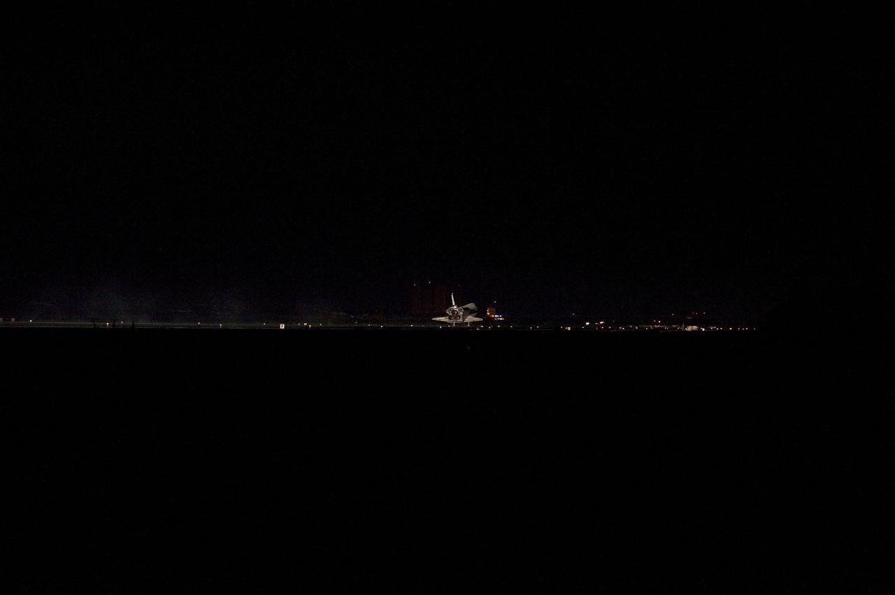 STS135-S-184 (21 July 2011) --- Space shuttle Atlantis' three main engines glow a red hue in the spacecraft's tail end as it touches down on the Shuttle Landing Facility's Runway 15 at NASA's Kennedy Space Center in Florida for the final time. Securing the space shuttle fleet's place in history, Atlantis marked the 26th nighttime landing of NASA's Space Shuttle Program and the 78th landing at Kennedy. Main gear touchdown was at 5:57:00 a.m. (EDT) on July 21, 2011, followed by nose gear touchdown at 5:57:20 a.m., and wheelstop at 5:57:54 a.m. Onboard are NASA astronauts Chris Ferguson, STS-135 commander; Doug Hurley, pilot; Sandy Magnus and Rex Walheim, both mission specialists. On the 37th shuttle mission to the International Space Station, STS-135 delivered more than 9,400 pounds of spare parts, equipment and supplies in the Raffaello multi-purpose logistics module that will sustain station operations for the next year. STS-135 was the 33rd and final flight for Atlantis, which has spent 307 days in space, orbited Earth 4,848 times and traveled 125,935,769 miles. Photo credit: NASA