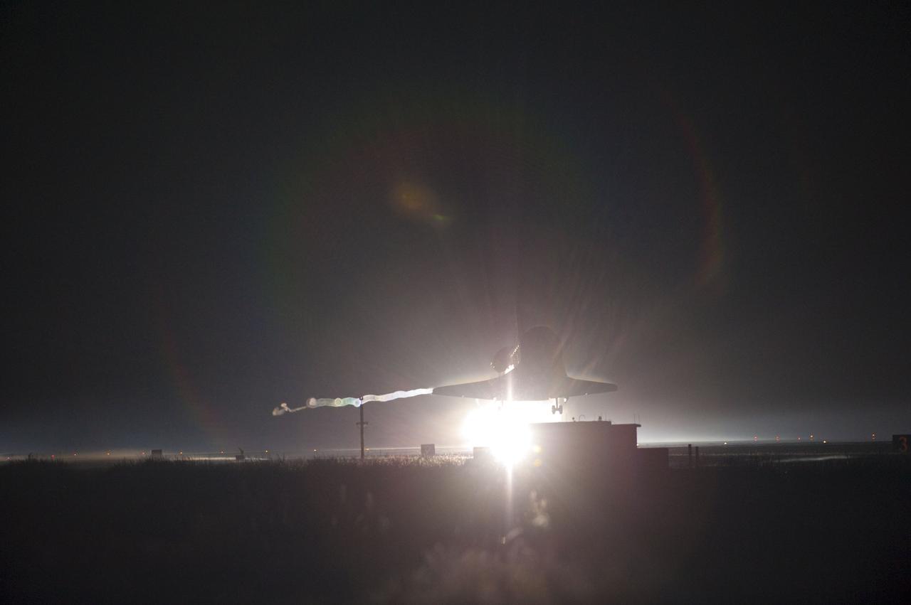 STS135-S-185 (21 July 2011) --- Xenon lights cast a halo of light on space shuttle Atlantis as the spacecraft approaches Runway 15 at NASA's Kennedy Space Center in Florida for the final time. Securing the space shuttle fleet's place in history, Atlantis marked the 26th nighttime landing of NASA's Space Shuttle Program and the 78th landing at Kennedy. Main gear touchdown was at 5:57:00 a.m. (EDT) on July 21, 2011, followed by nose gear touchdown at 5:57:20 a.m., and wheelstop at 5:57:54 a.m. Onboard are NASA astronauts Chris Ferguson, STS-135 commander; Doug Hurley, pilot; Sandy Magnus and Rex Walheim, both mission specialists. On the 37th shuttle mission to the International Space Station, STS-135 delivered more than 9,400 pounds of spare parts, equipment and supplies in the Raffaello multi-purpose logistics module that will sustain station operations for the next year. STS-135 was the 33rd and final flight for Atlantis, which has spent 307 days in space, orbited Earth 4,848 times and traveled 125,935,769 miles. Photo credit: NASA