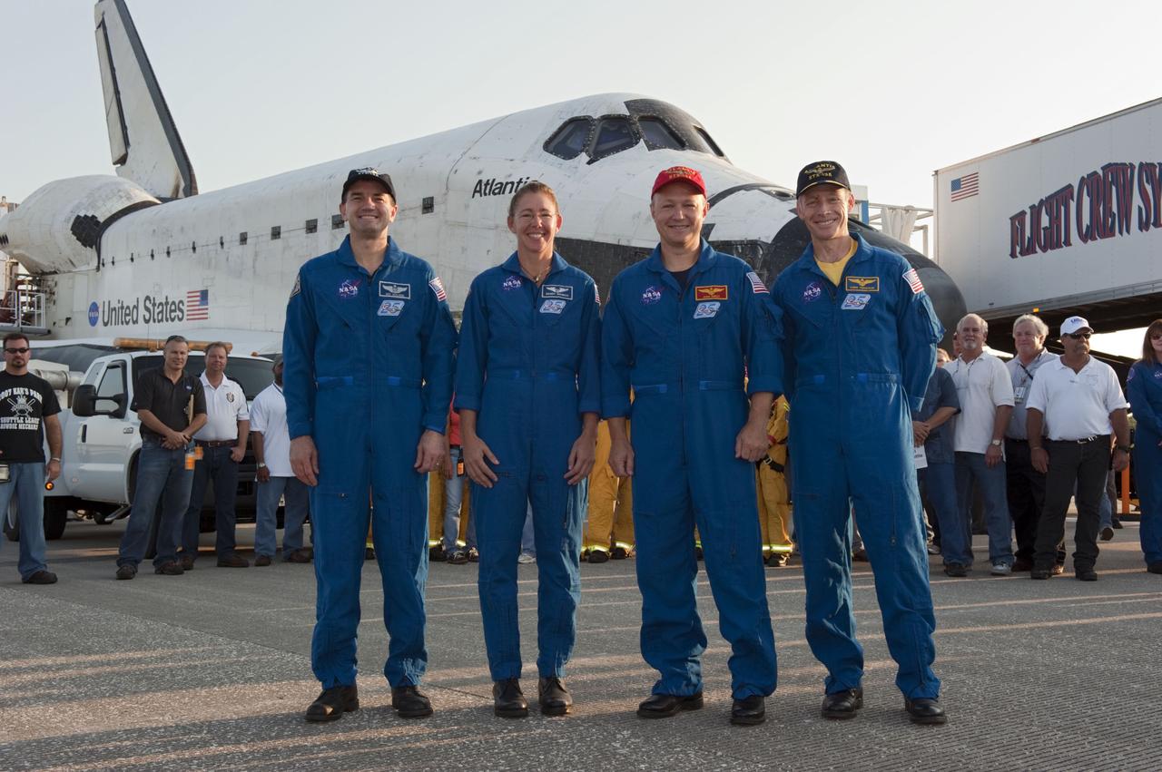 STS135-S-214 (21 July 2011) --- The final four astronauts of NASA's Space Shuttle Program stand proudly in front of space shuttle Atlantis, the remarkable spacecraft that took them on the STS-135 mission to the International Space Station. From right, are NASA astronauts Chris Ferguson, commander; Doug Hurley, pilot; Sandy Magnus and Rex Walheim, both mission specialists. The crew returned to Earth on the Shuttle Landing Facility's Runway 15 at NASA's Kennedy Space Center in Florida at 5:57 a.m. (EDT) on July 21, 2011. Atlantis' final return from space completed a 13-day, 5.2-million-mile journey to the International Space Station. STS-135 delivered spare parts, equipment and supplies in the Raffaello multi-purpose logistics module that will sustain station operations for the next year. STS-135 was the 33rd and final flight for Atlantis, which has spent 307 days in space, orbited Earth 4,848 times and traveled 125,935,769 miles.