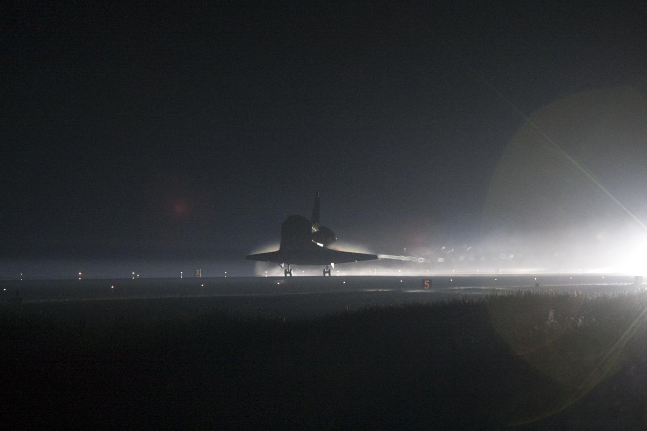STS135-S-218 (21 July 2011) --- Space shuttle Atlantis returns to Earth for the last time on Runway 15 at NASA's Kennedy Space Center in Florida just before sunrise July 21, 2011. Atlantis touched down on Runway 15 at 5:57 a.m. (EDT), bringing an end to the STS-135 mission and NASA's Space Shuttle Program. Onboard are NASA astronauts Chris Ferguson, commander; Doug Hurley, pilot; Sandy Magnus and Rex Walheim, both mission specialists. On the 37th shuttle mission to the International Space Station, STS-135 delivered more than 9,400 pounds of spare parts, equipment and supplies in the Raffaello multi-purpose logistics module that will sustain station operations for the next year. STS-135 was the 33rd and final flight for Atlantis, which has spent 307 days in space, orbited Earth 4,848 times and traveled 125,935,769 miles. Photo credit: NASA
